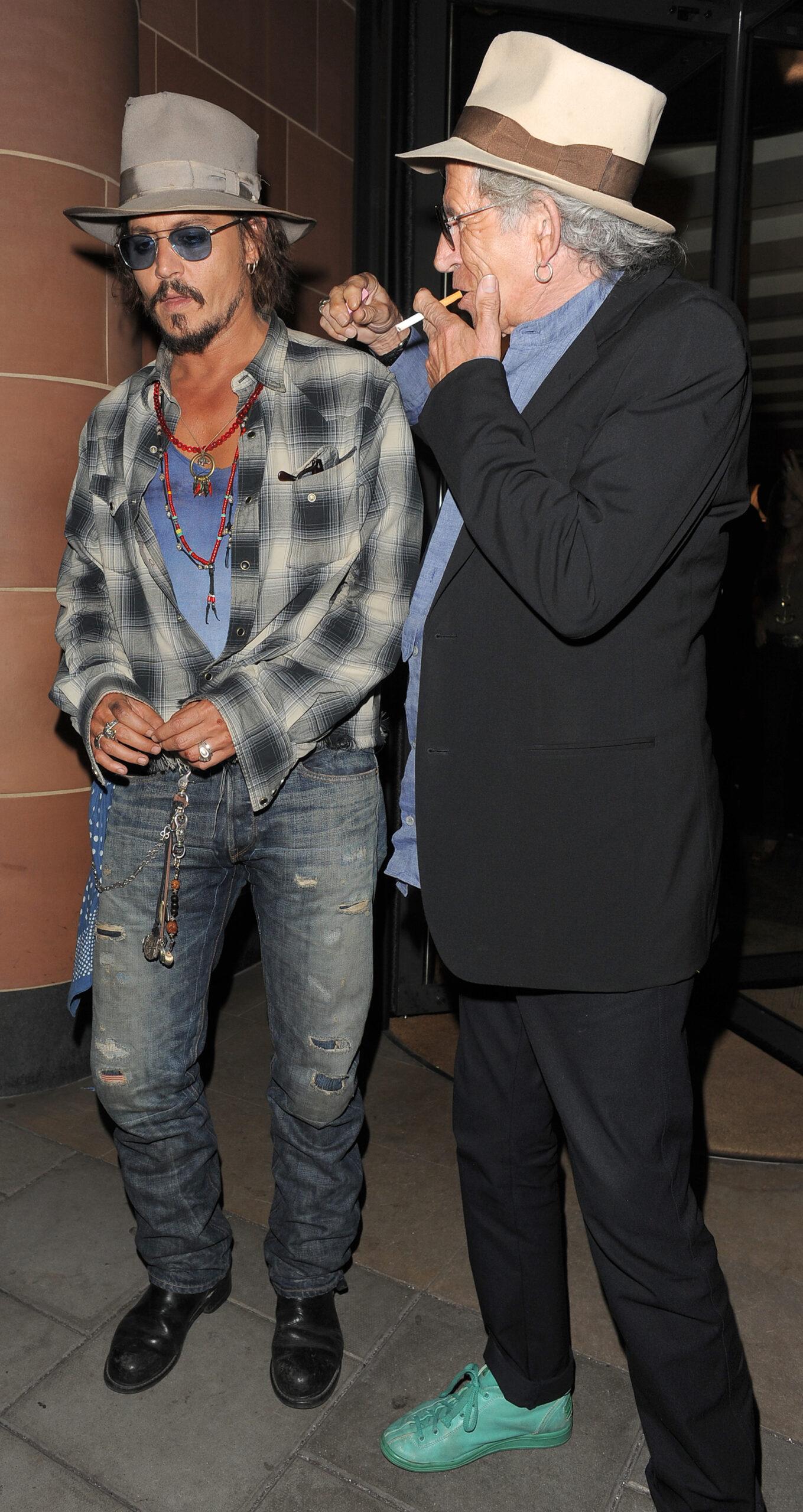 Johnny Depp and Keith Richards both wearing fedora hats and sunglasses leaving apos C London apos restaurant Depp was sporting some cuts on his face and a rather painful bruise on his lower cheek