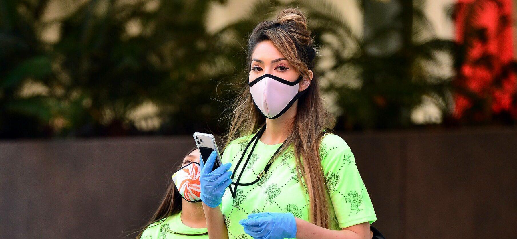 Farrah Abraham and Sophia wear gloves and designer face mask during a walk in Los Angeles
