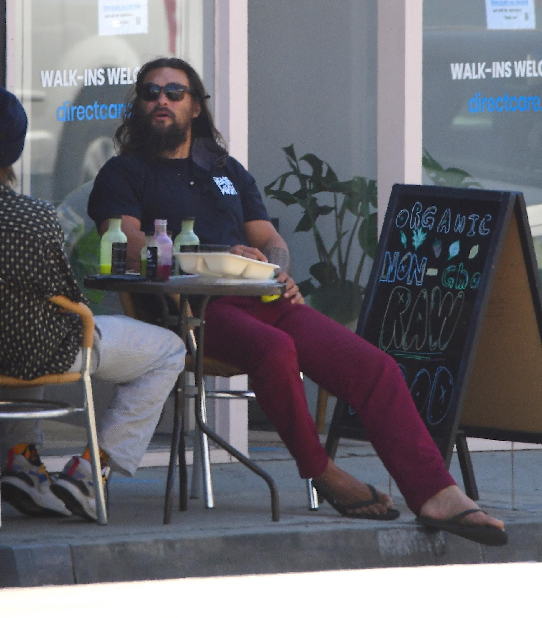 Jason Momoa grabs a healthy drink at an organic raw juice bar in LA