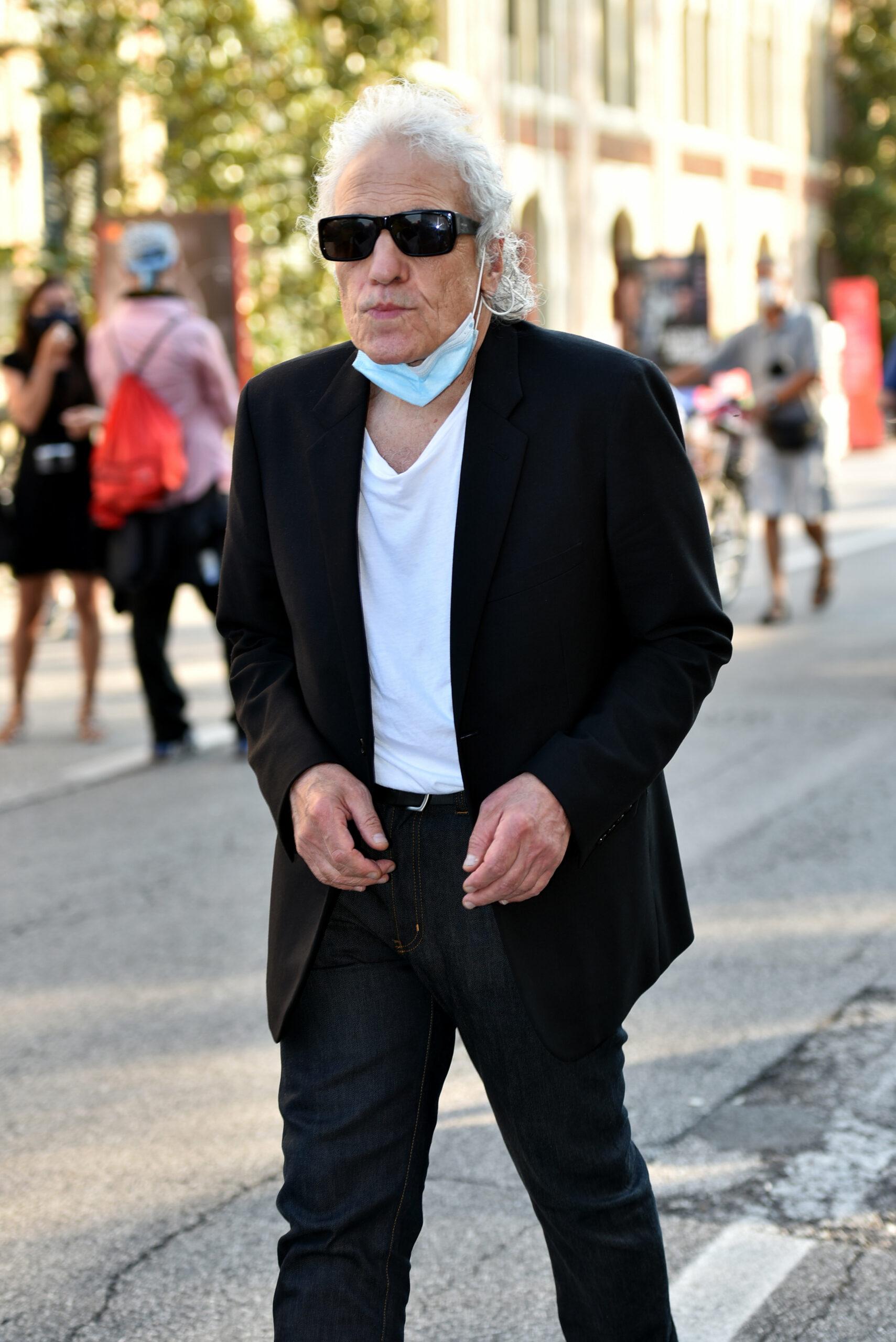 Abel Ferrara walks in the 77th Venice Film Festival