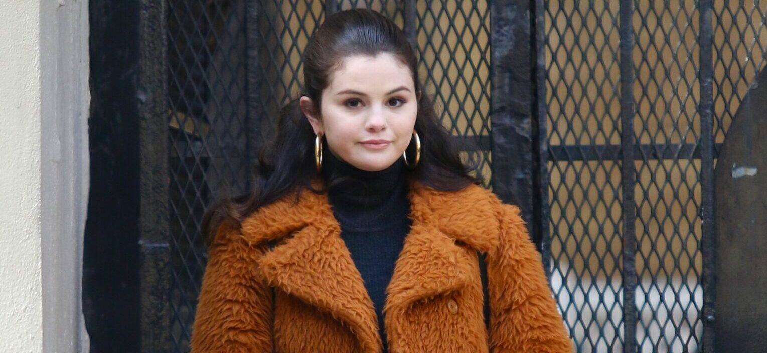 Selena Gomez is all smiles sporting a long brown orange furry coat while filming Only Murders In The Building in NYC