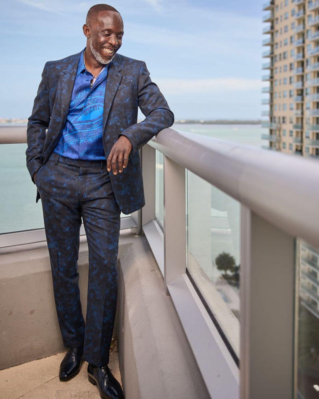 A photo showing Micahel K Williams in a blue patterned suit.