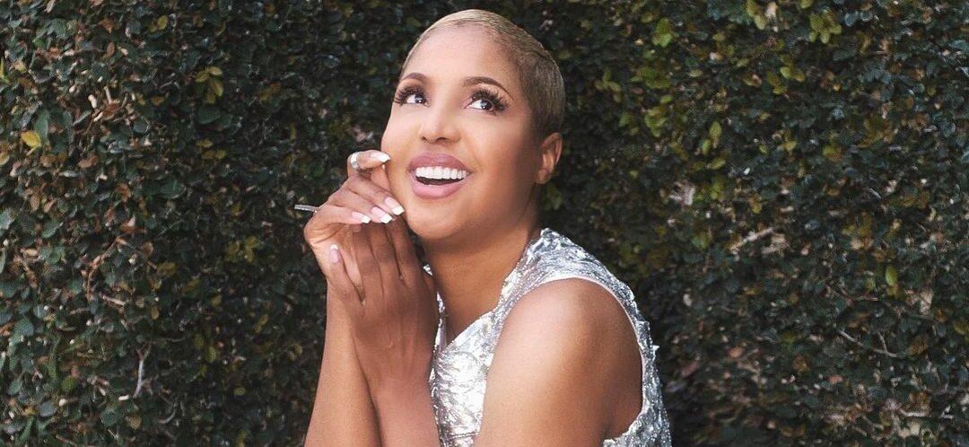 A lovely photo showing Toni Braxton in a shiny outfit.