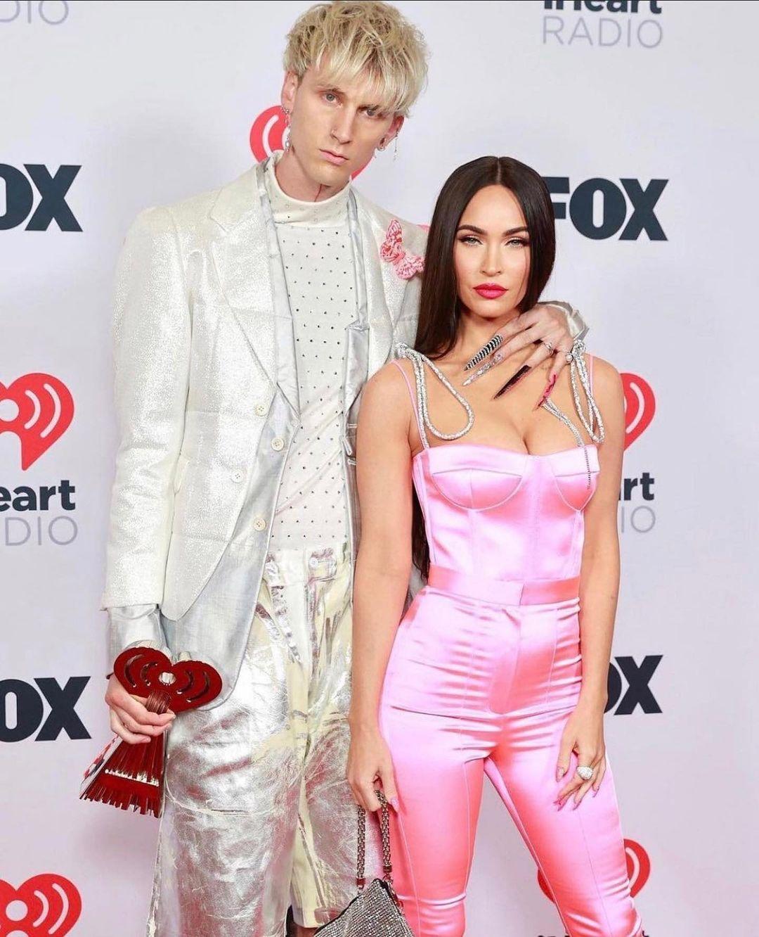 A photo of Machine Gun Kelly and Megan Fox all dolled up at an event