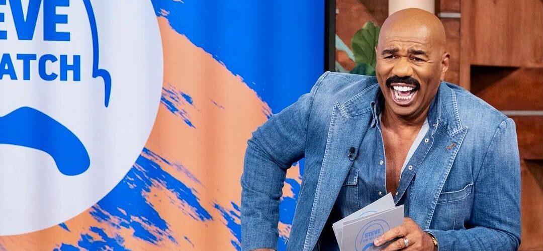A photo showing Steve Harvey in a denim outfit.