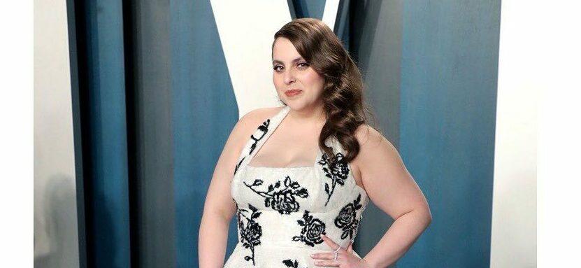 A photo of Beanie Feldstein in a flowered dress at the Vanity Fair event