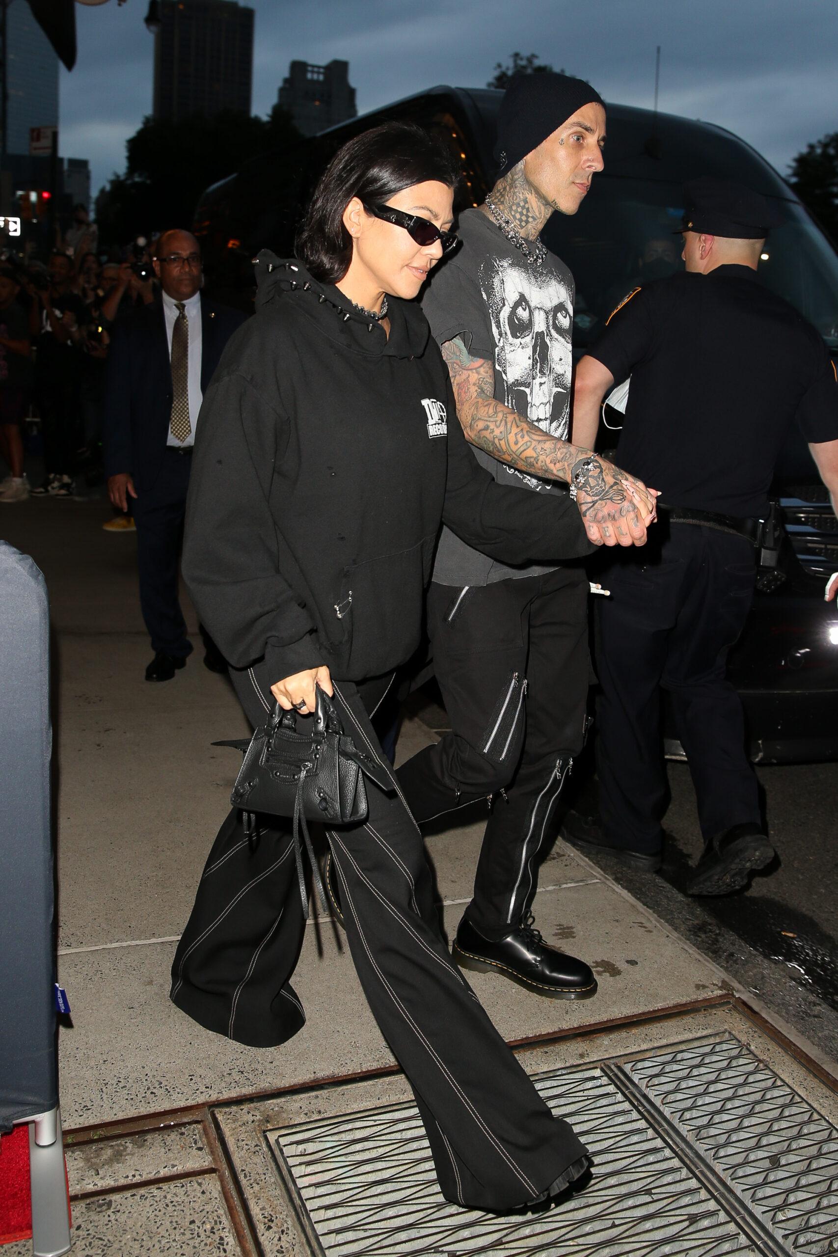 Kourtney Kardashian and Travis Barker seen hand-in-hand as leaving their hotel in NYC