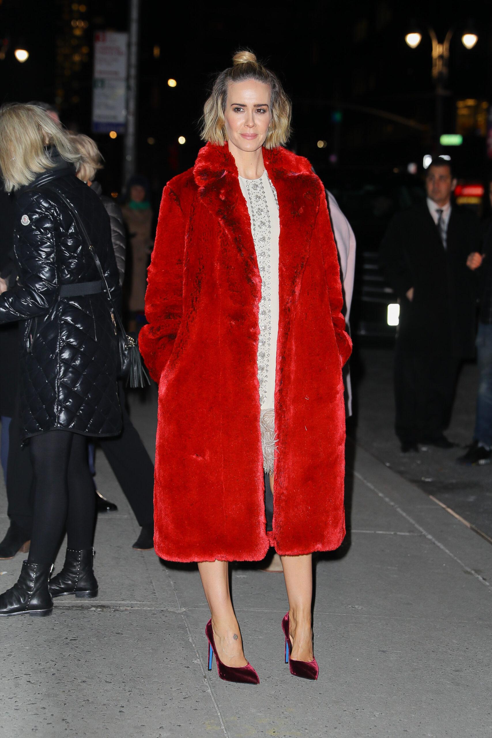 Sarah Paulson wears a red coat while arriving at The Late Show with Stephen Colbert in NYC on Jan 17 2019