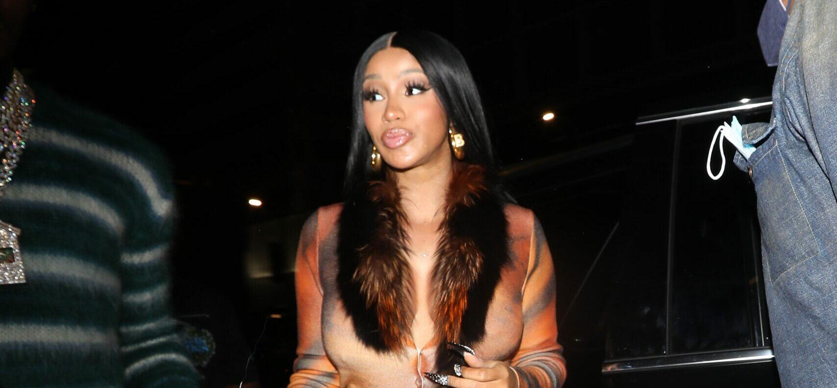 A pregnant Cardi B wears a leopard print dress as she and Offset head to BOA Steakhouse