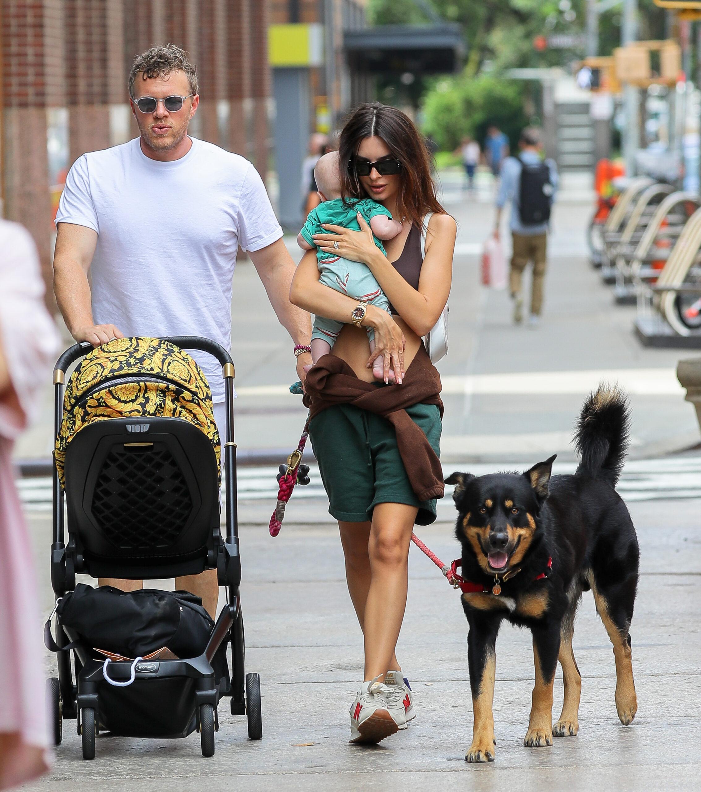 Emily Ratajkowski is all smiling while carrying her Baby as they taking a stroll with husband Sebastian Bear-McClard in NYC