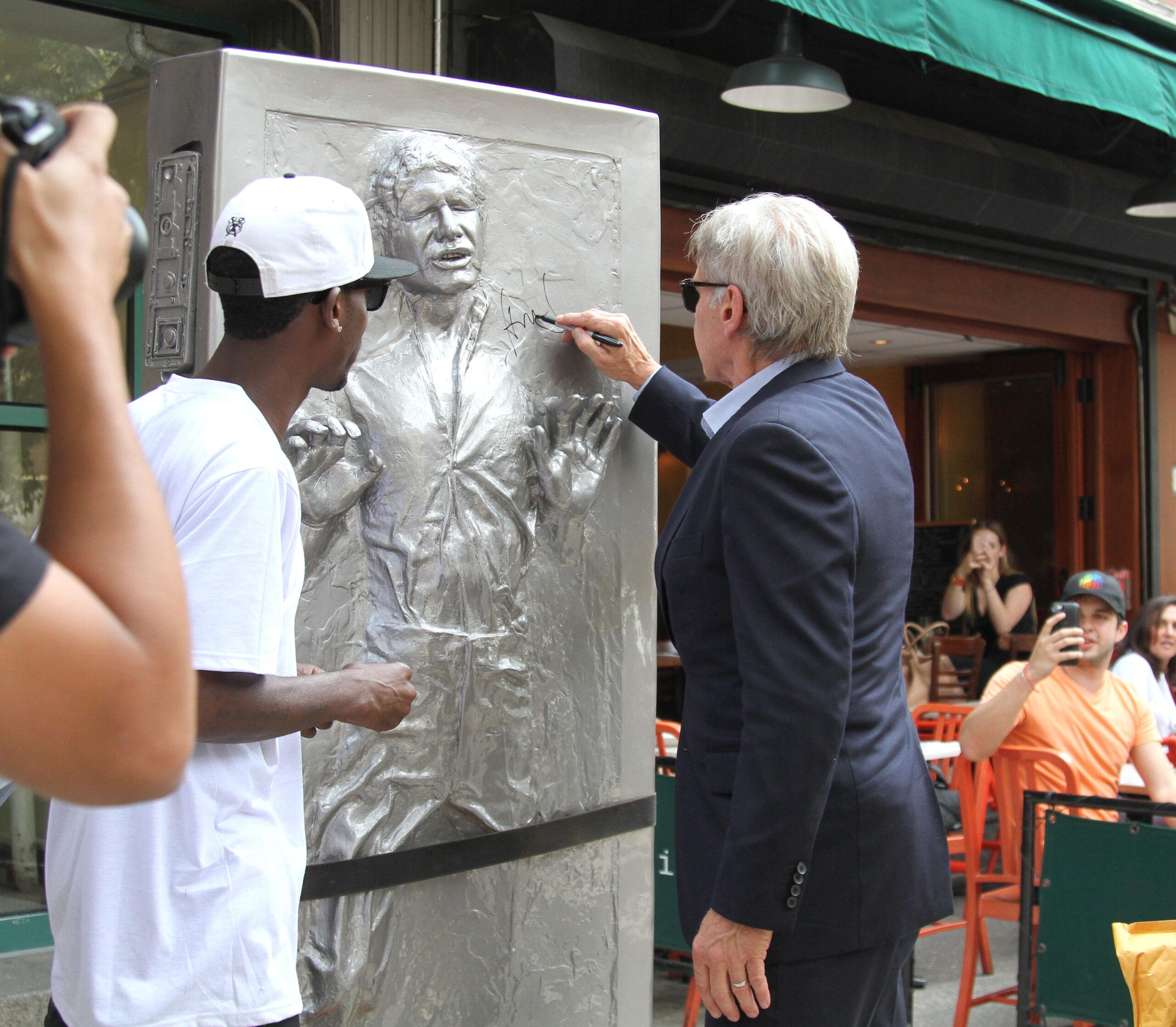 Harrison Ford signs Life-Size figure of Han Solo in Carbonite Statue and causes chaos with autograph collectors in NYC
