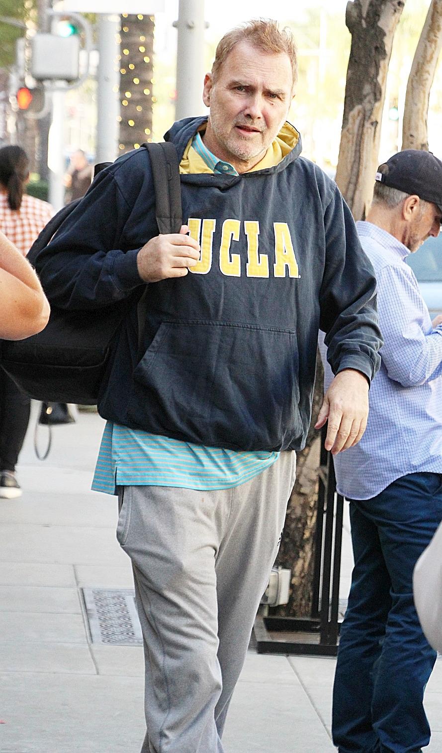 Canadian comedian Norm MacDonald seen wearing UCLA sweat shirt