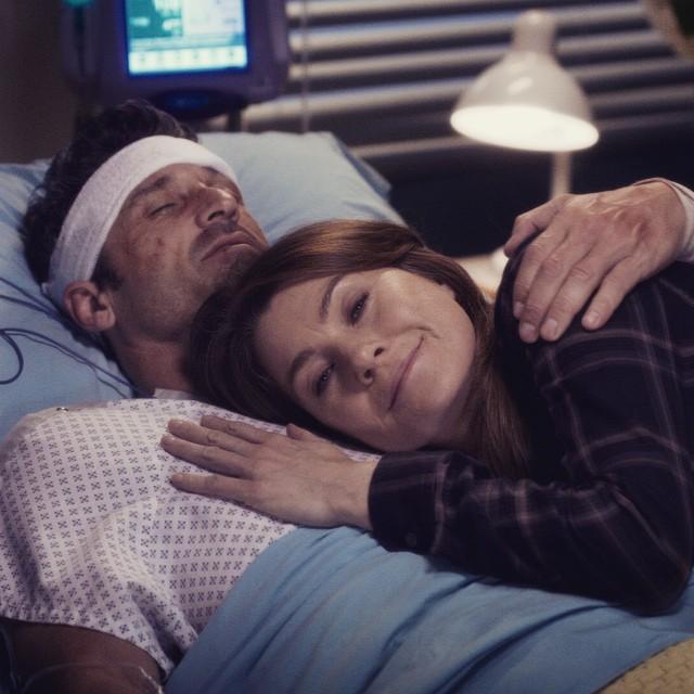 A scene from 'Grey's Anatomy,' showing Ellen Pompeo and Patrick Dempsey hugging on a hospital bed.