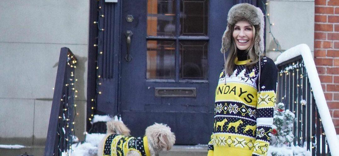 A photo showing Carole Radziwill and her dog outside her home in sweaters for the cold.