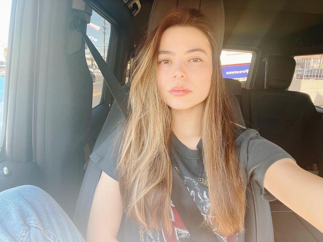 Miranda Cosgrove takes a car selfie while on a drive.