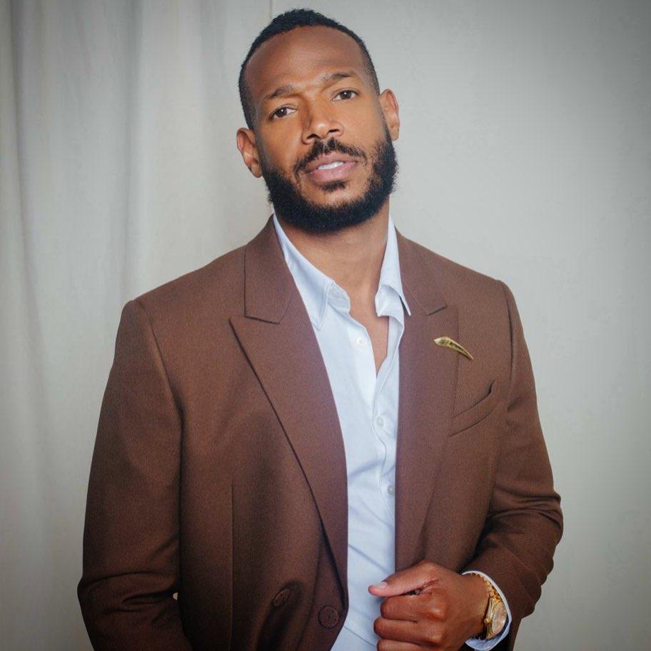 Marlon Wayans looks incredible in this photo showing him in a brown suit.