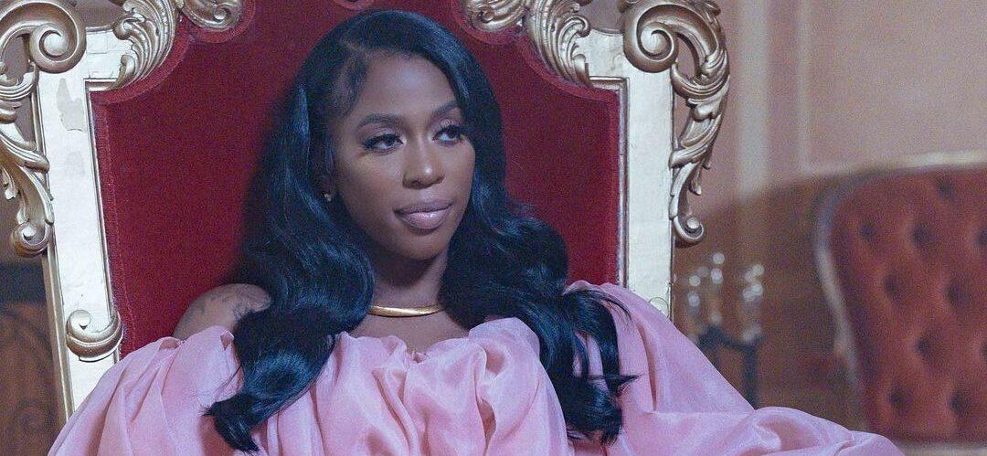 A photo showing Kash Doll in a pink silk puffy design dress.