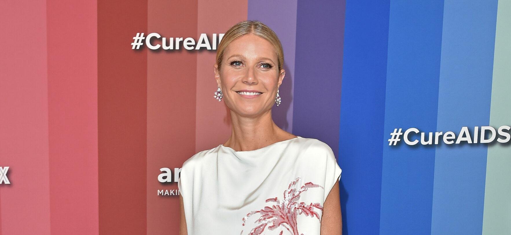 A photo of Gwyneth Paltrow in a white long dress with flowery embroidery