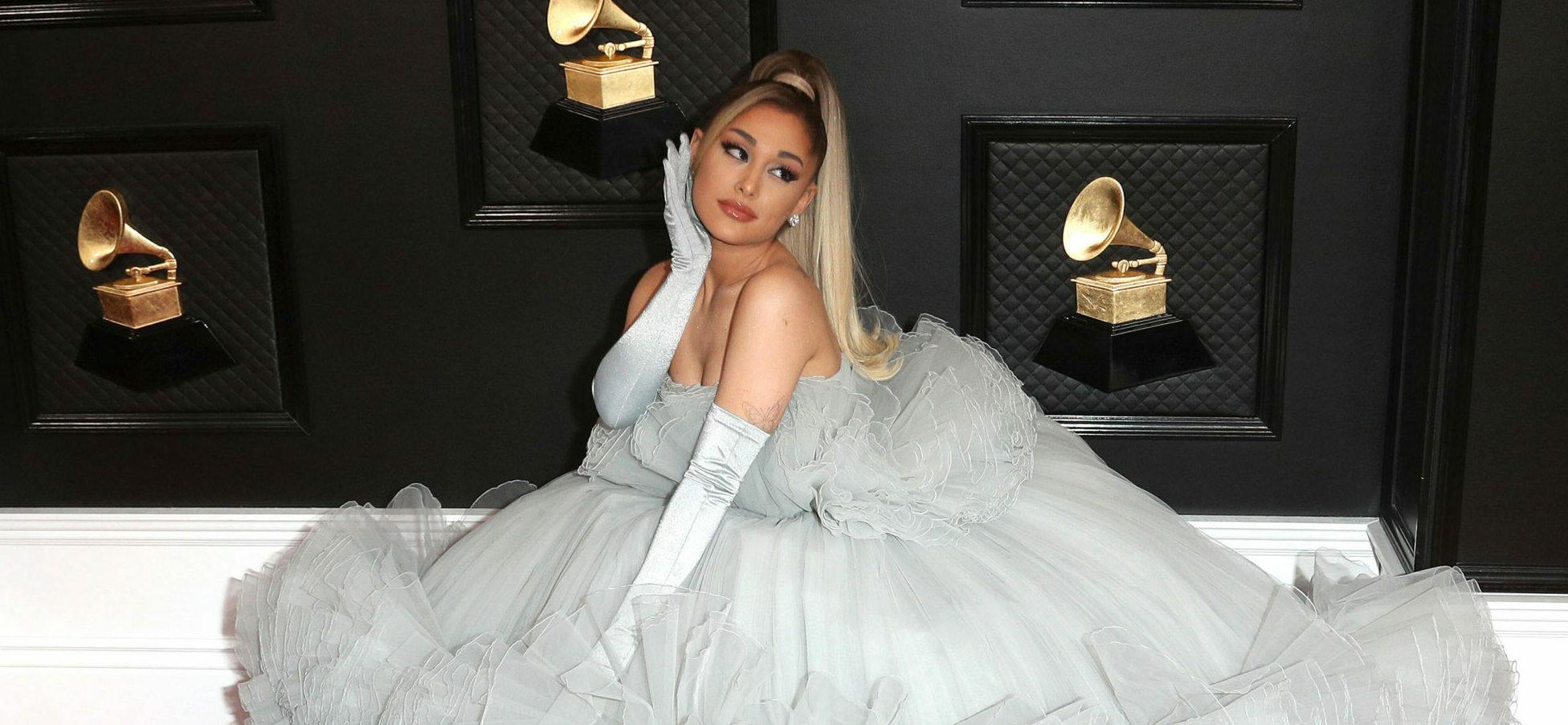 Ariana Grande at the 62nd Annual Grammy Awards sporting a gray ball gown.