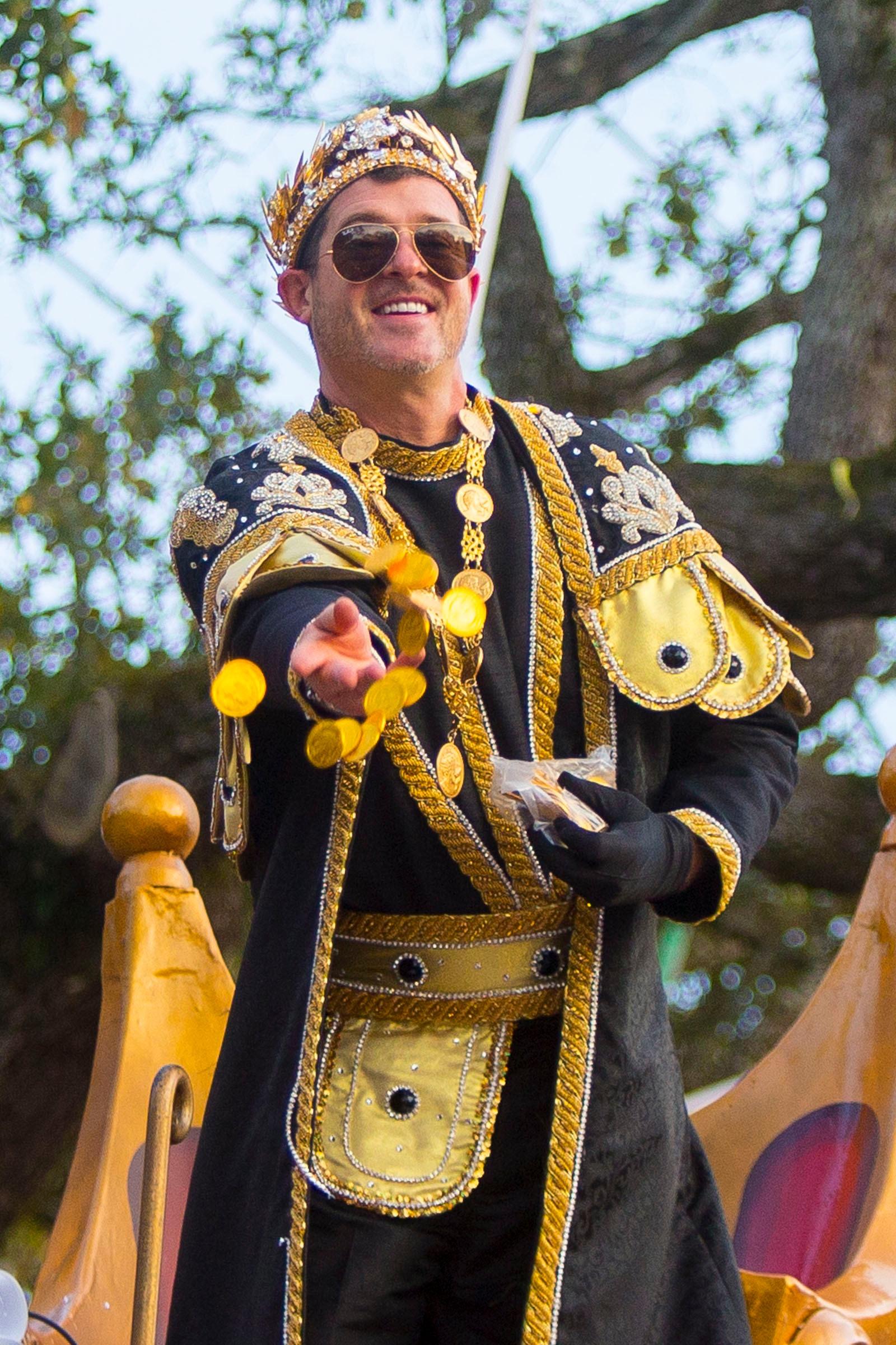 Blurred lines singer And Masked Singer judge Robin Thicke reigned as King in the Mardi Gras parade 'Bacchus' with his son Julian as tribute to his father Alan.