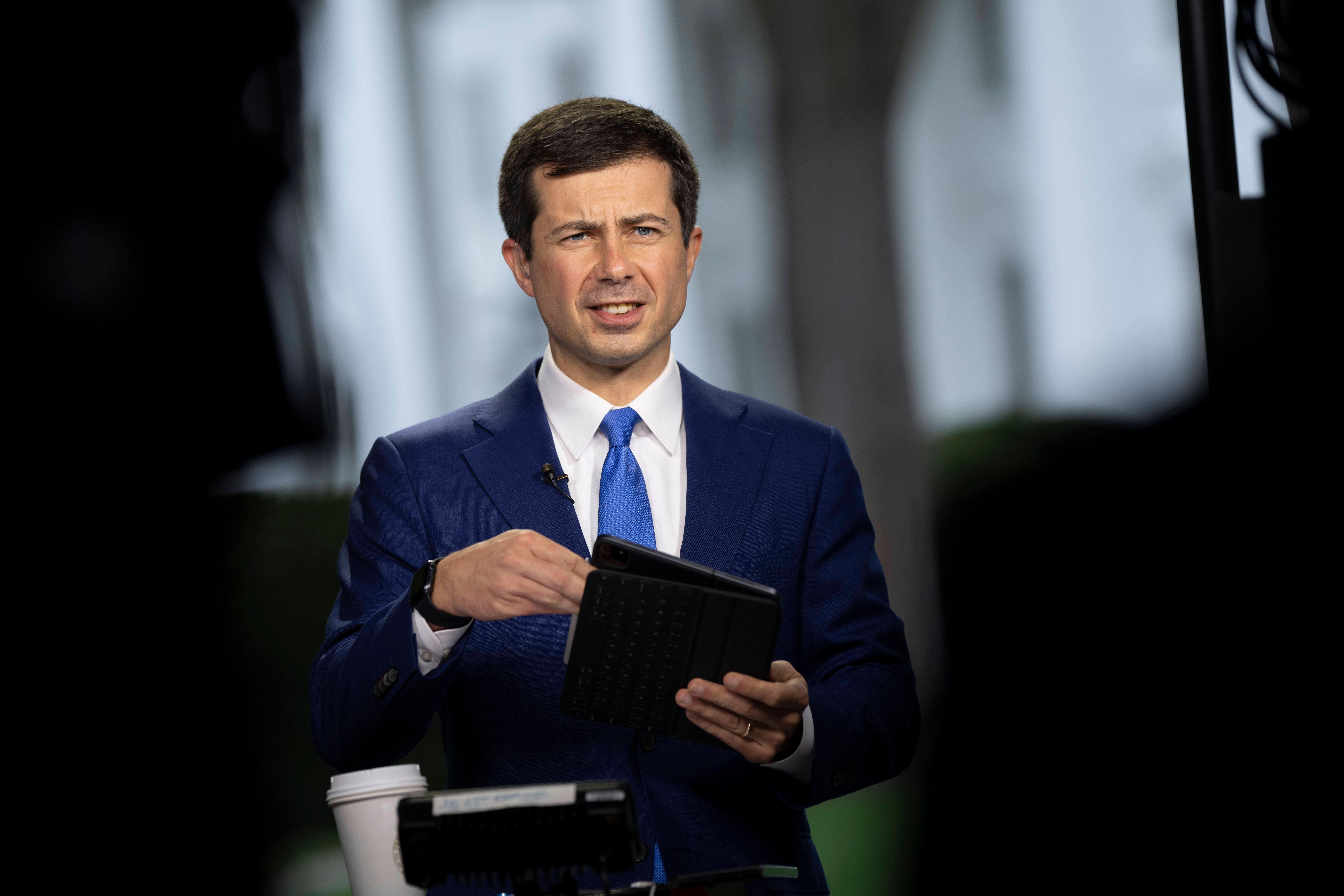 United States Secretary of Transportation Pete Buttigieg participates in a television interview at the White House