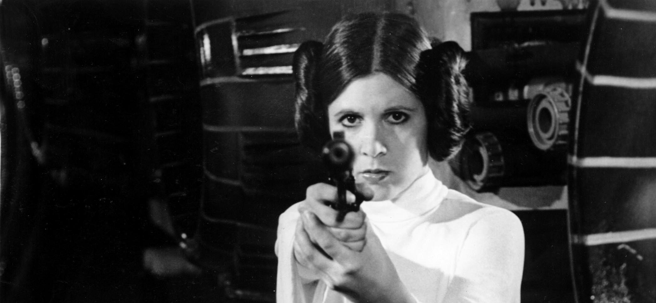 Carrie Fisher appears in a black and white photo as Princess Leia in Star Wars