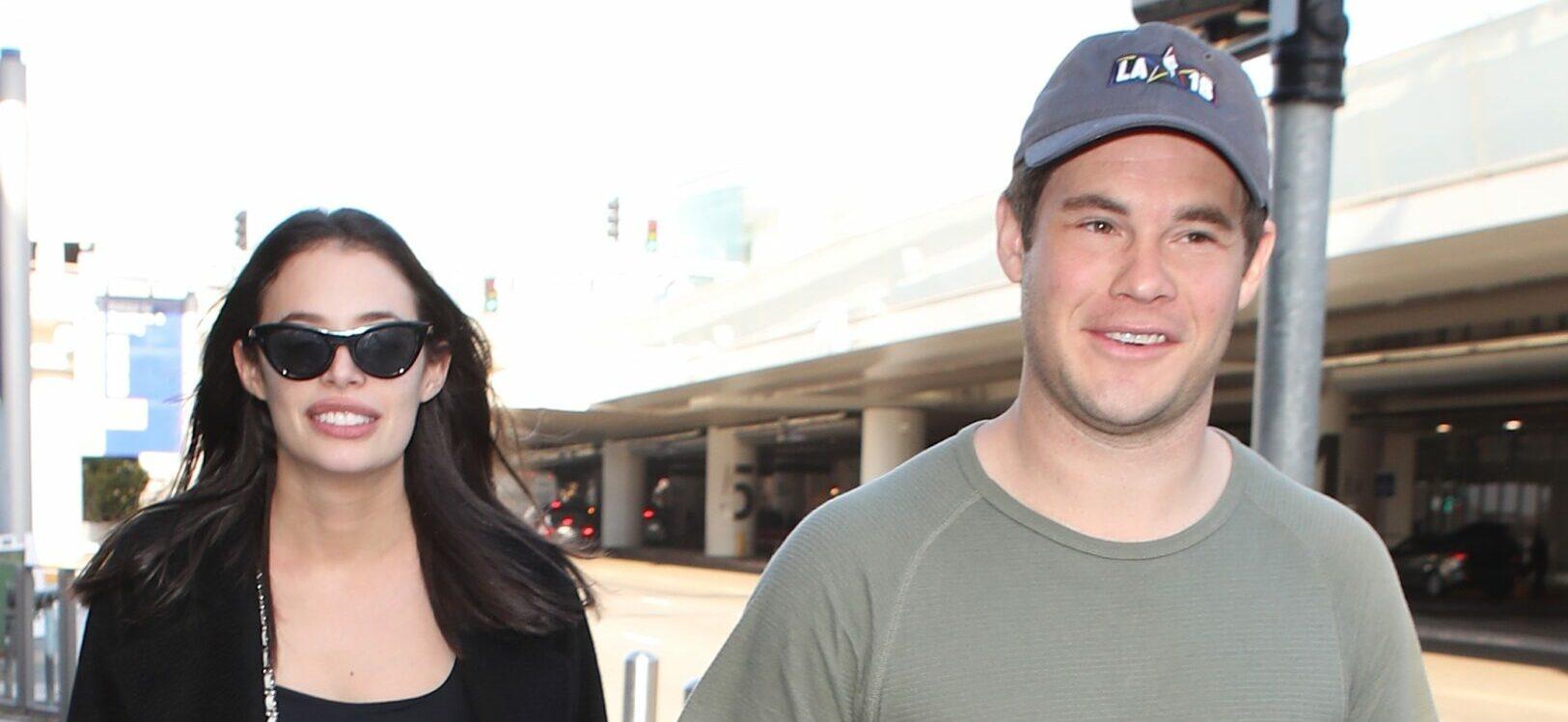 Adam devine and girlfriend Chloe Bridges arrive to LAX after trip to Hawaii