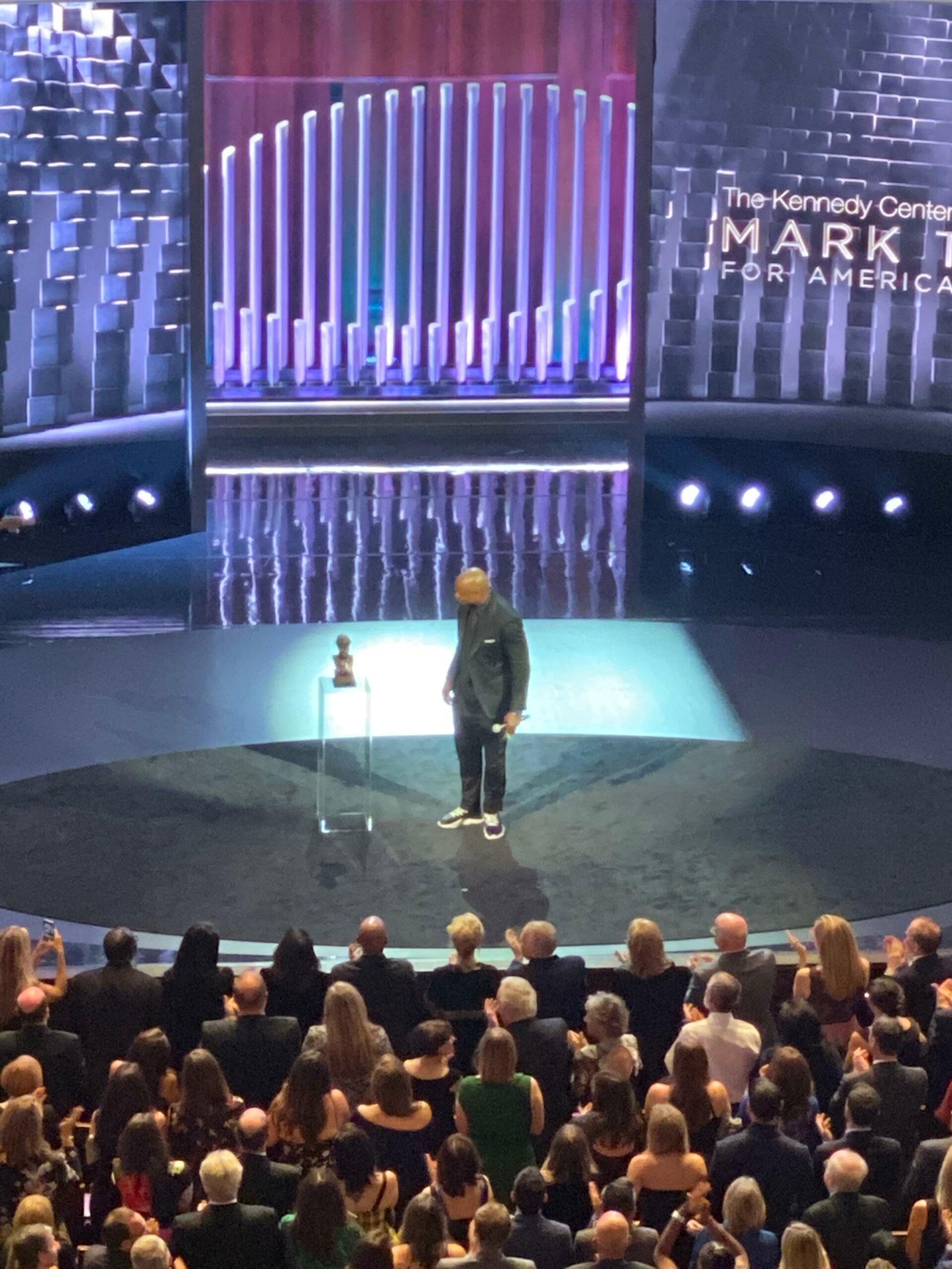 Dave Chappelle on stage to receive the Mark Twain Prize
