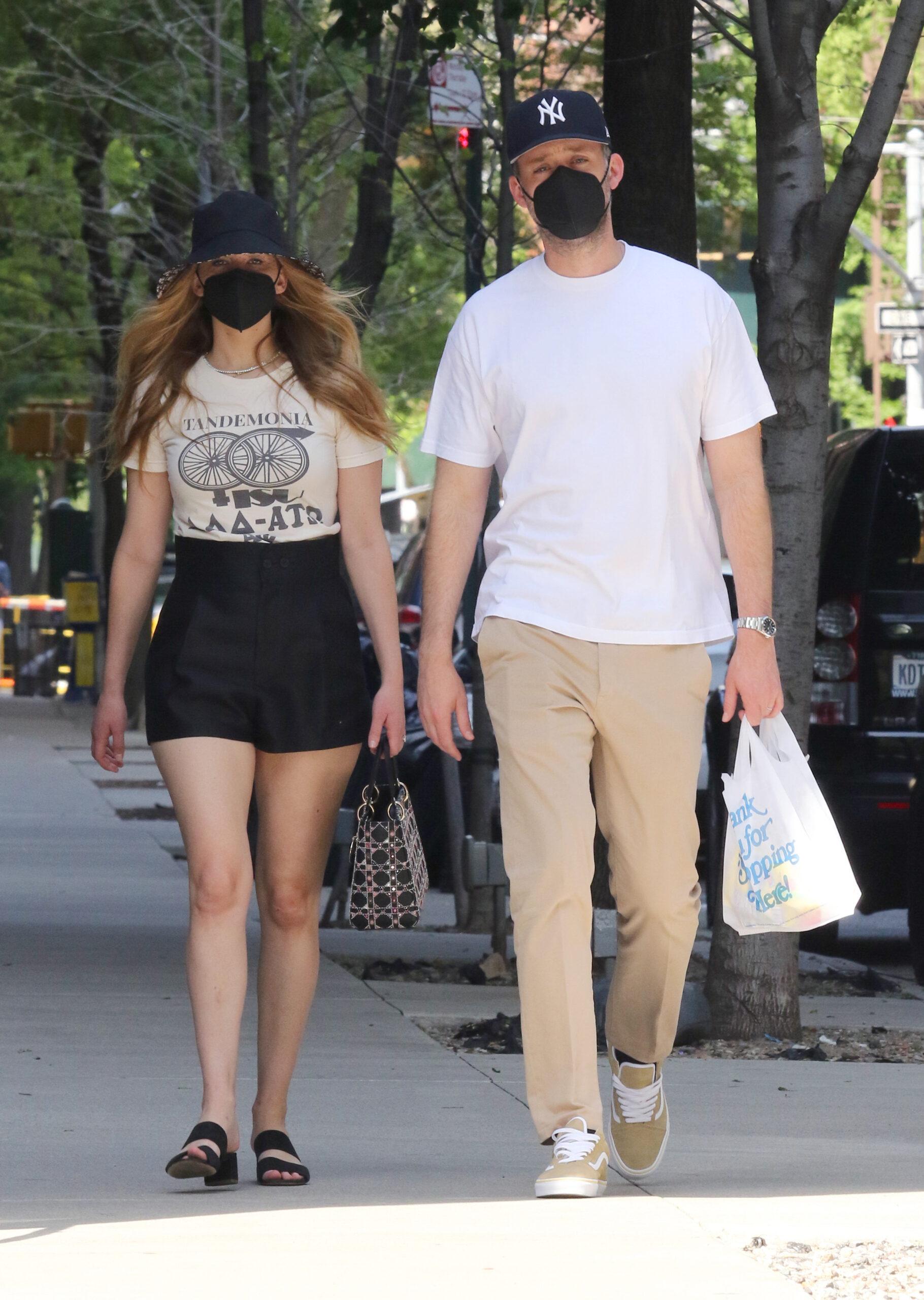 Jennifer Lawrence and husband Cooke Maroney hold hands and signs autographs for a fan in NYC