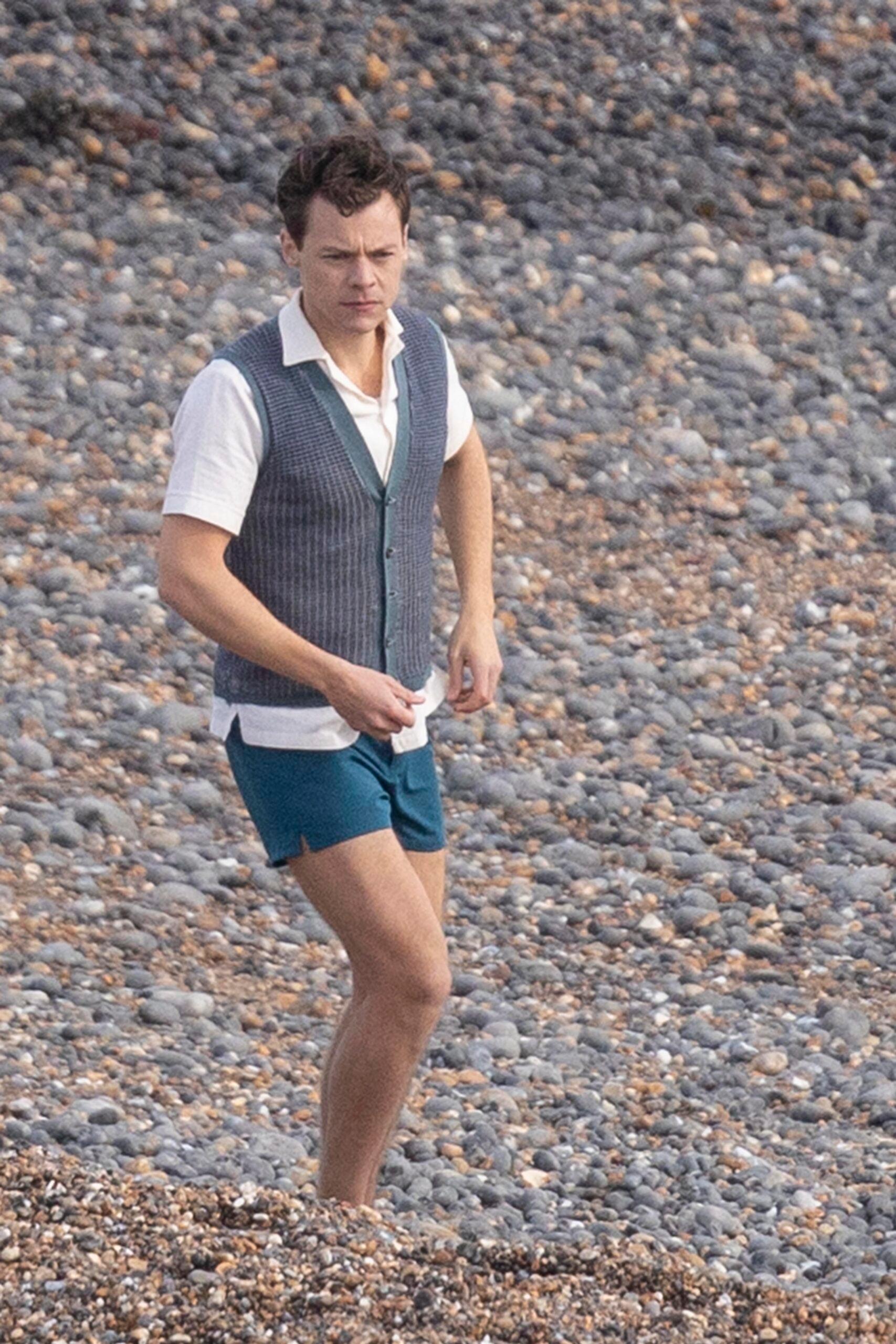 Harry Styles larks around on the beach with a man in vest and underpants as he films My Policeman in East Sussex