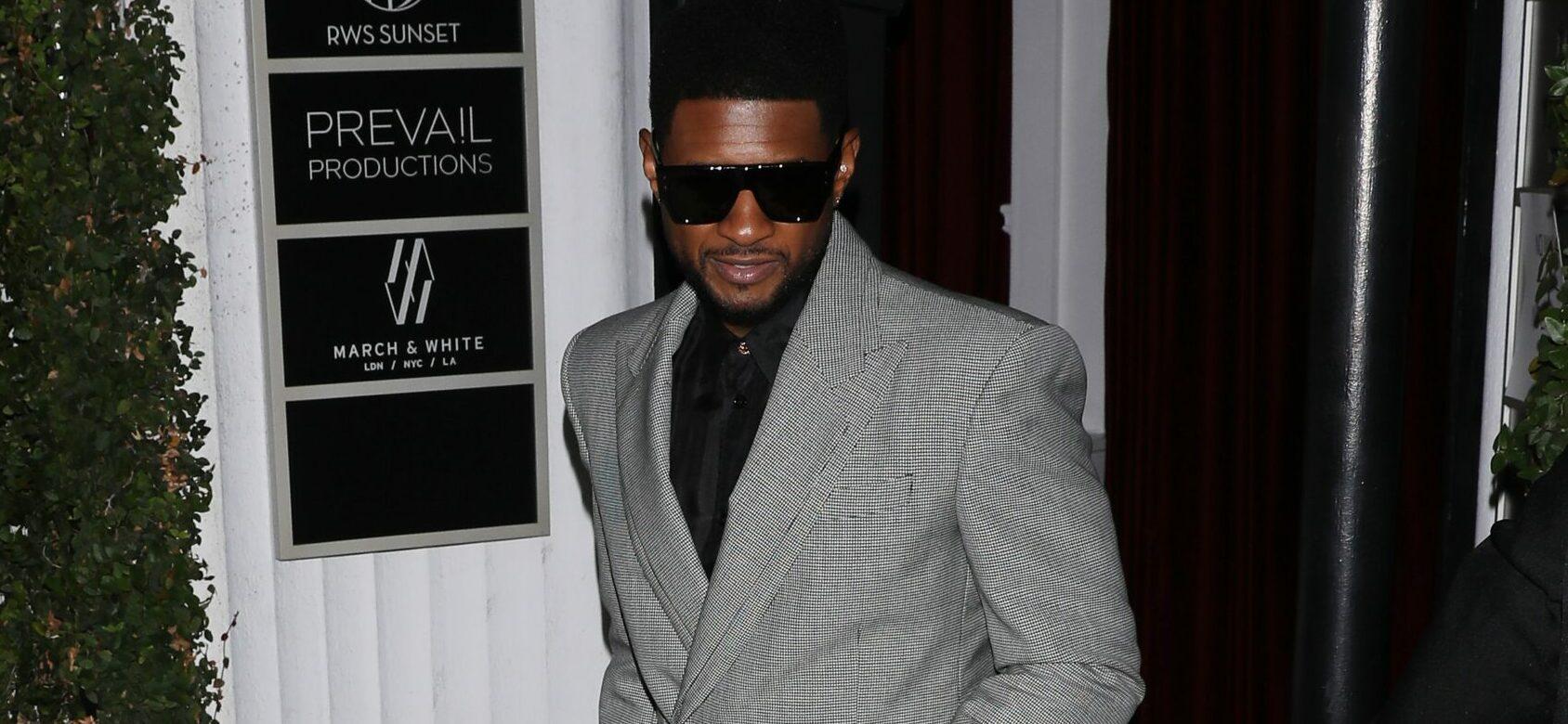 A well dressed Usher attends Justin Bieber apos s apos Freedom Art Experience apos art gallery