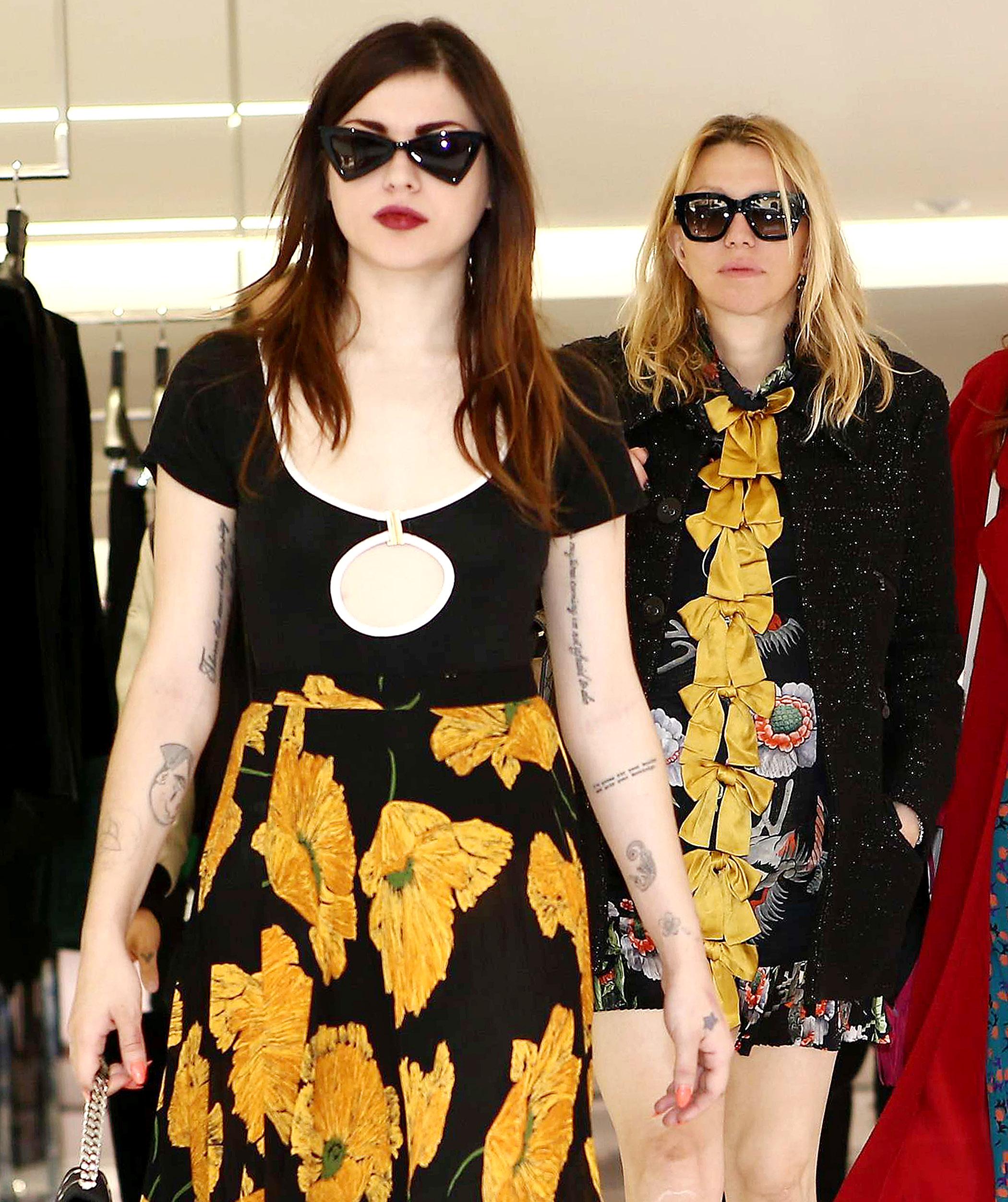 Courtney Love and her daughter Frances Bean Cobain come out of Saint Laurent Store in Paris