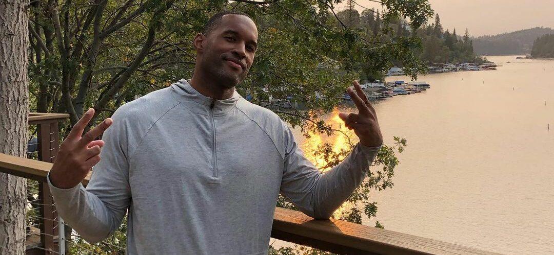 A photo showing Lawrence Saint-Victor in a gray sweatshirt, showing off the 'peace' sign.
