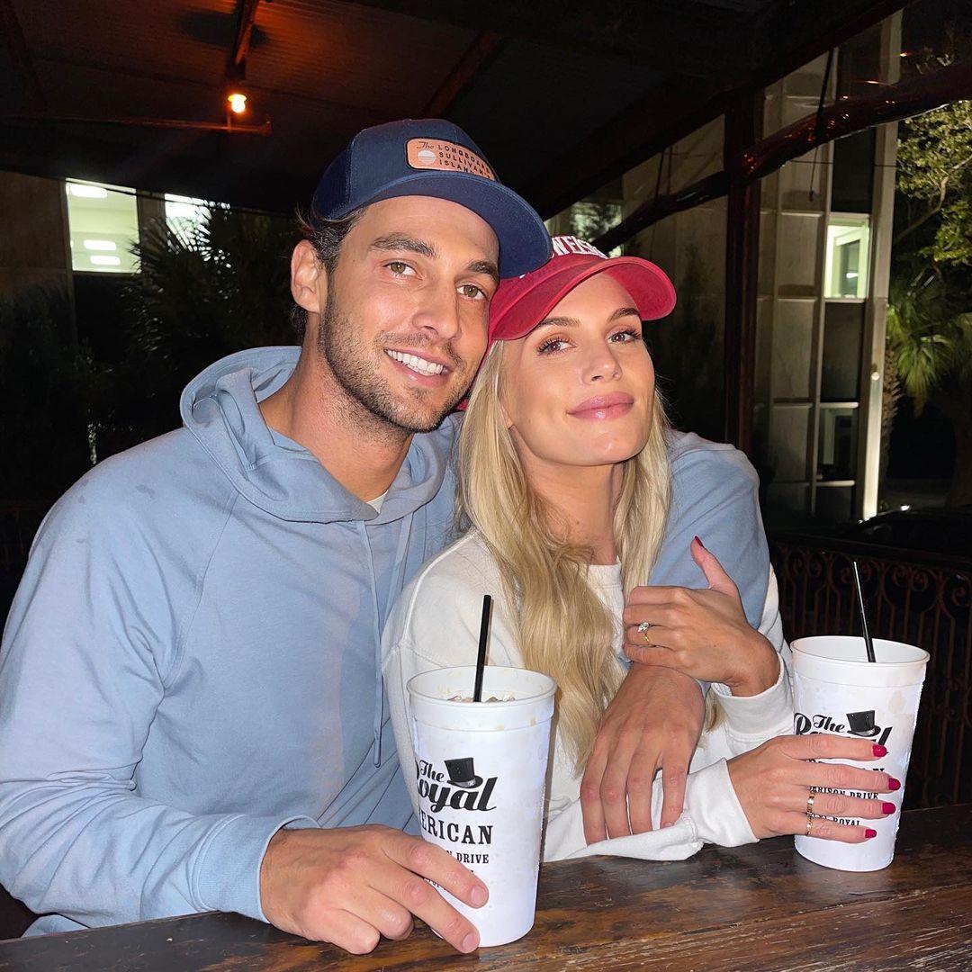 A photo showing Madison LeCroy and her fiance holding huge white cups with straws.