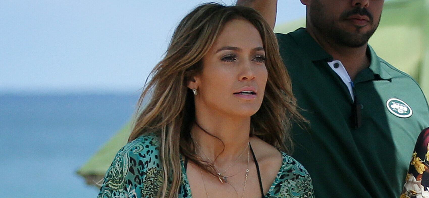 Jennifer Lopez wears a green dress similar to her iconic Versace dress to film a music video for her new song "Live It Up" featuring Pitbull on the beach in Ft. Lauderdale