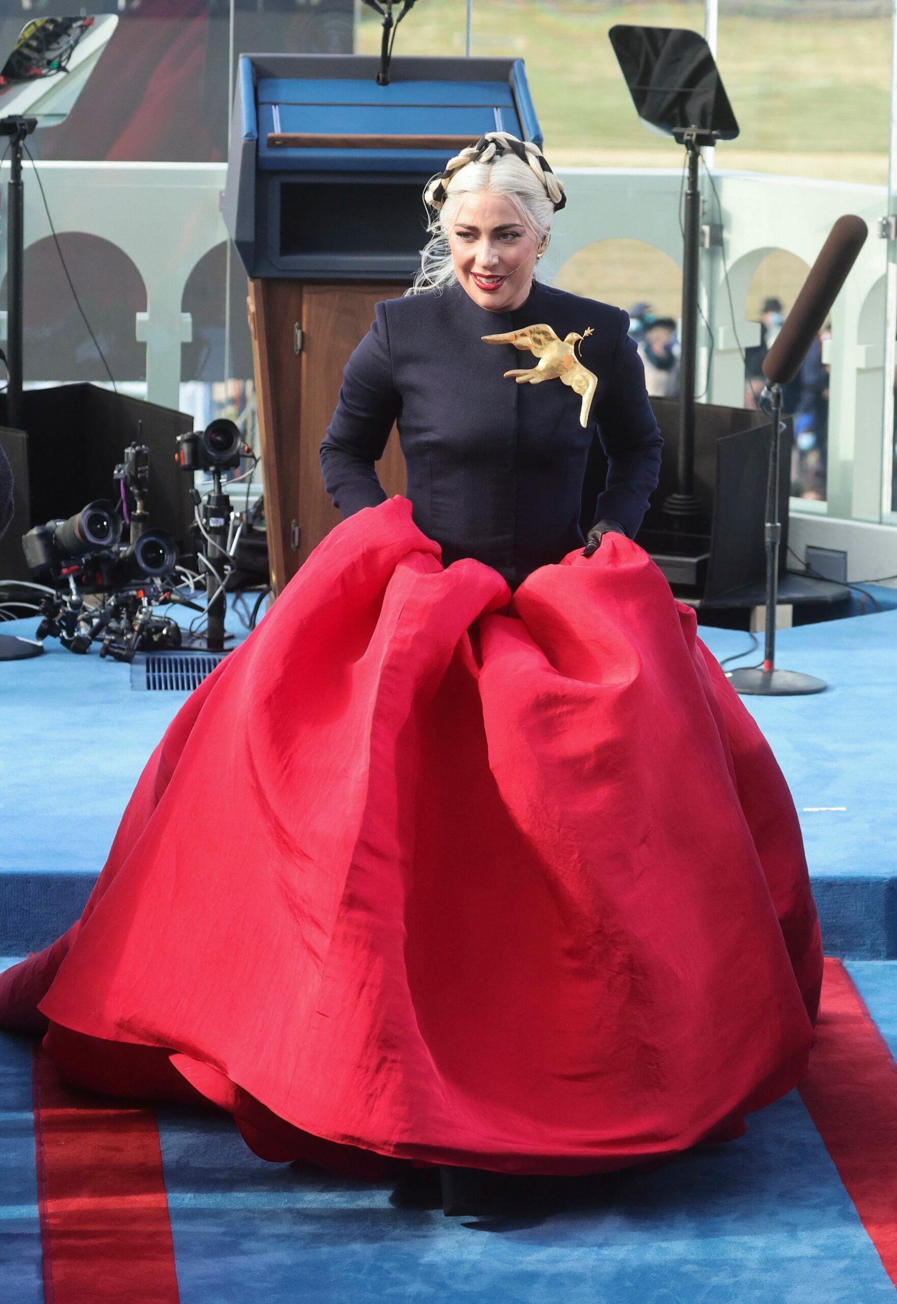 Lady Gaga in a red and black gown 