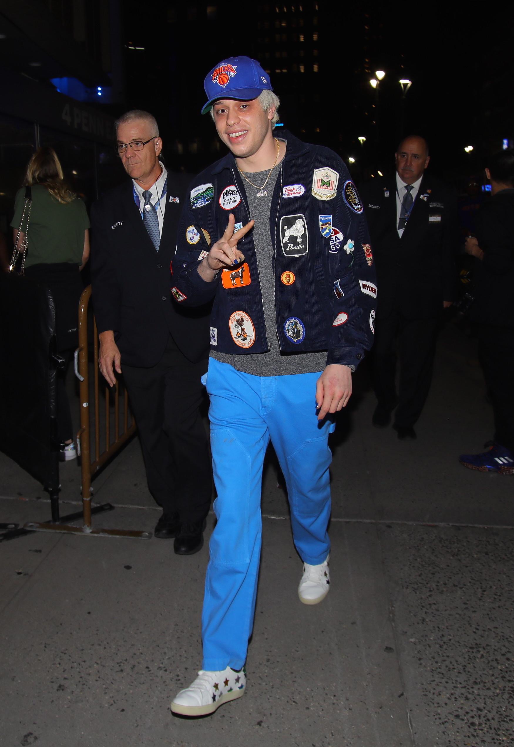 Pete Davidson in jacket with pins 