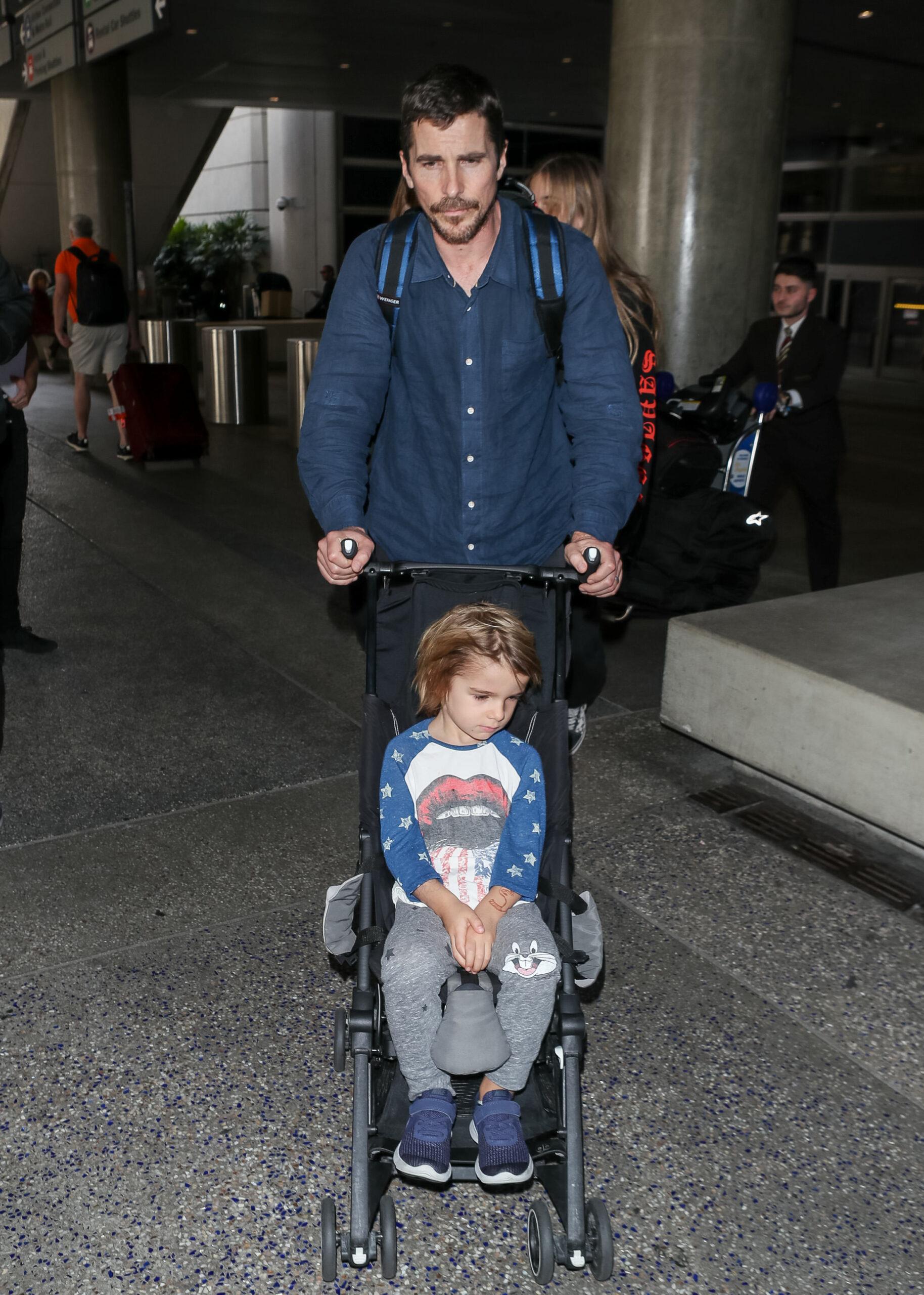 Christian Bale and his family at LAX International Airport