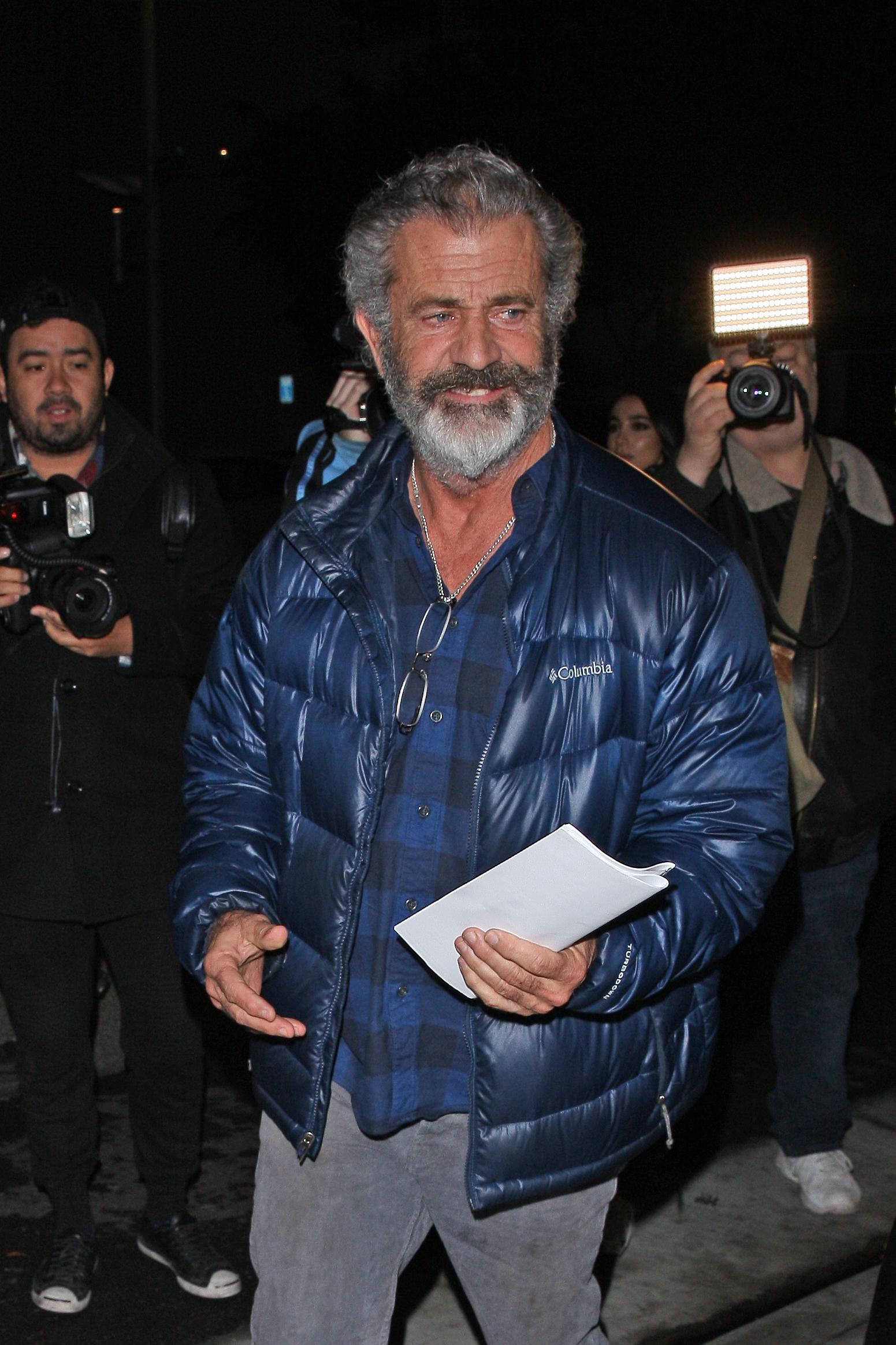 Mel Gibson is spotted leaving The Palm restaurant with a mystery woman after having dinner