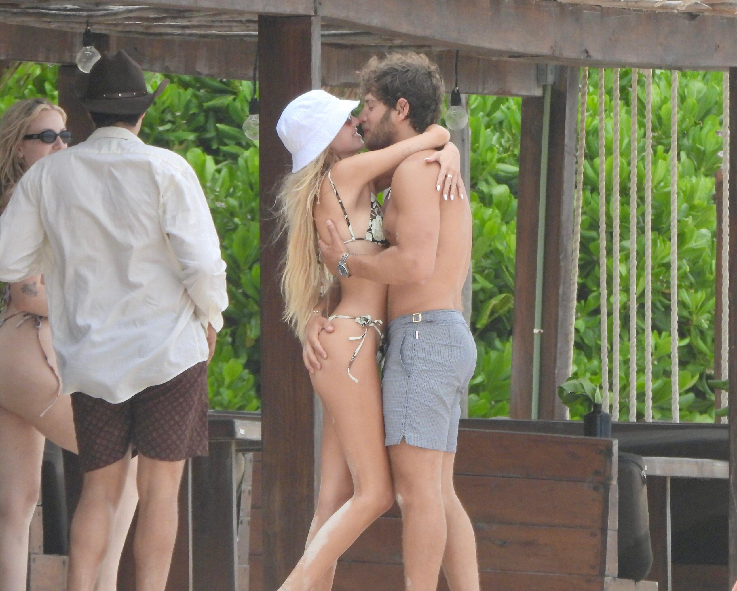 Delilah Hamlin kisses boyfriend Eyal Booker during a beach day in Mexico with her parents Lisa Rinna and Harry Hamlin