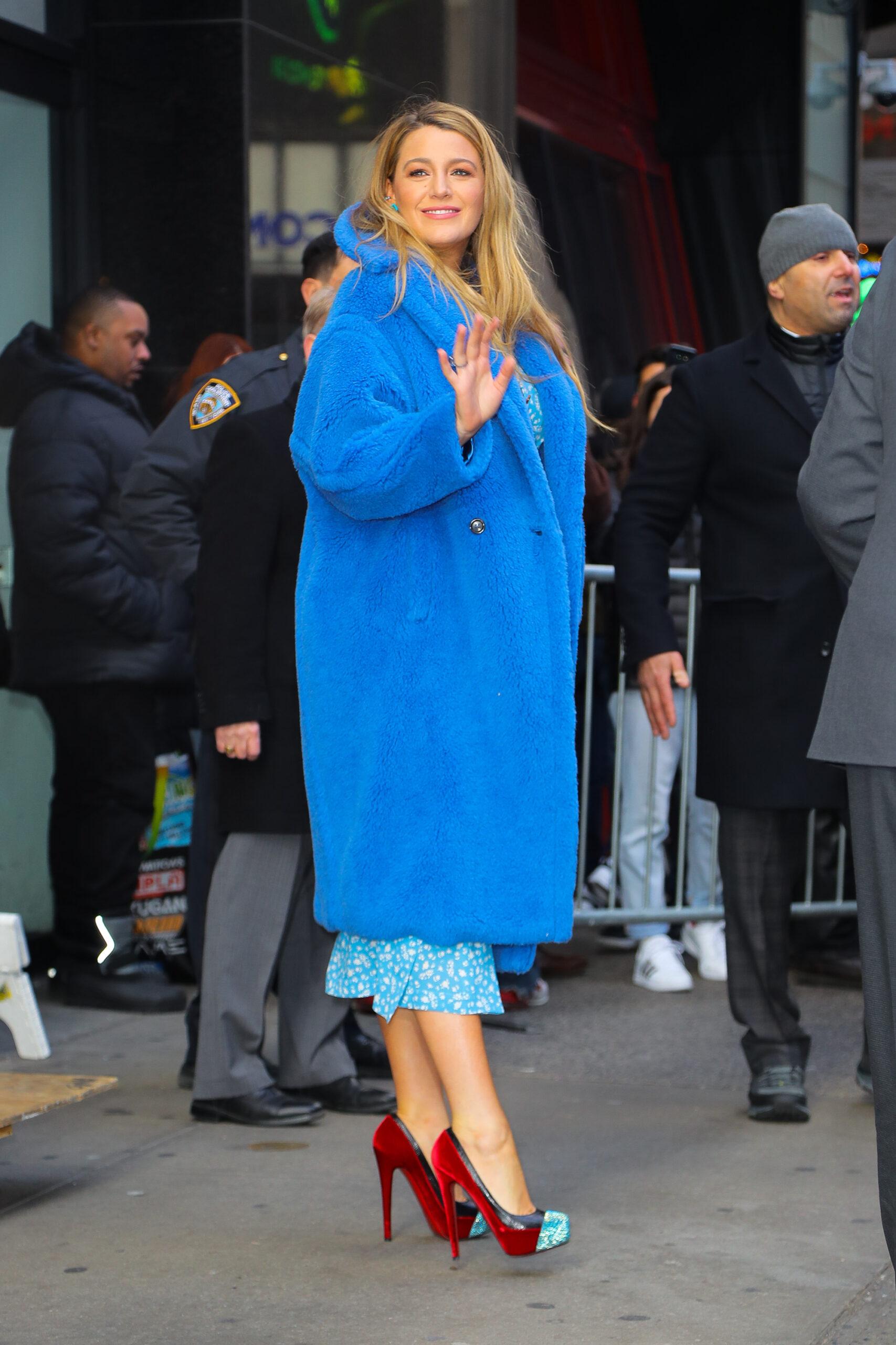 Blake Lively wears a blue fur coat while leaving Good Morning America in NYC