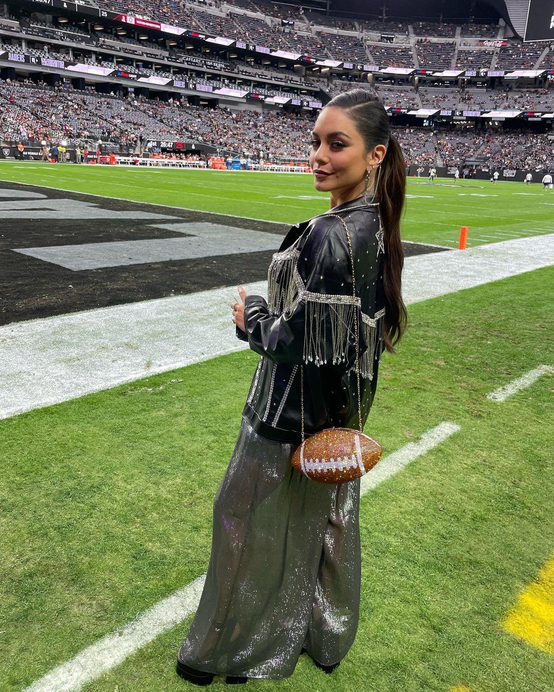 Vanessa Hudgens carried a football clutch at the Raiders' game in Las Vegas