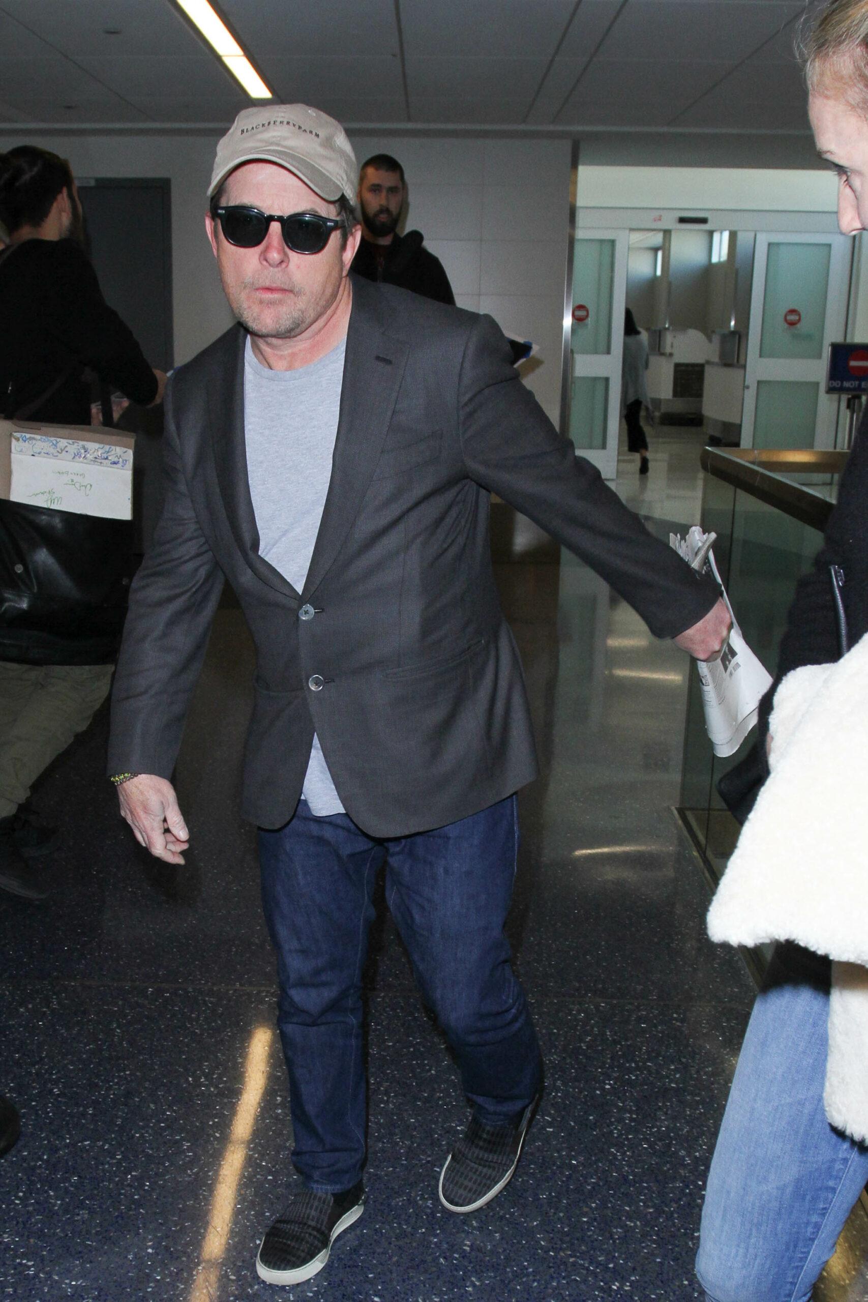 Michael J. Fox and Tracy Pollan are seen at LAX Airport in Los Angeles, California. 30 Jan 2017