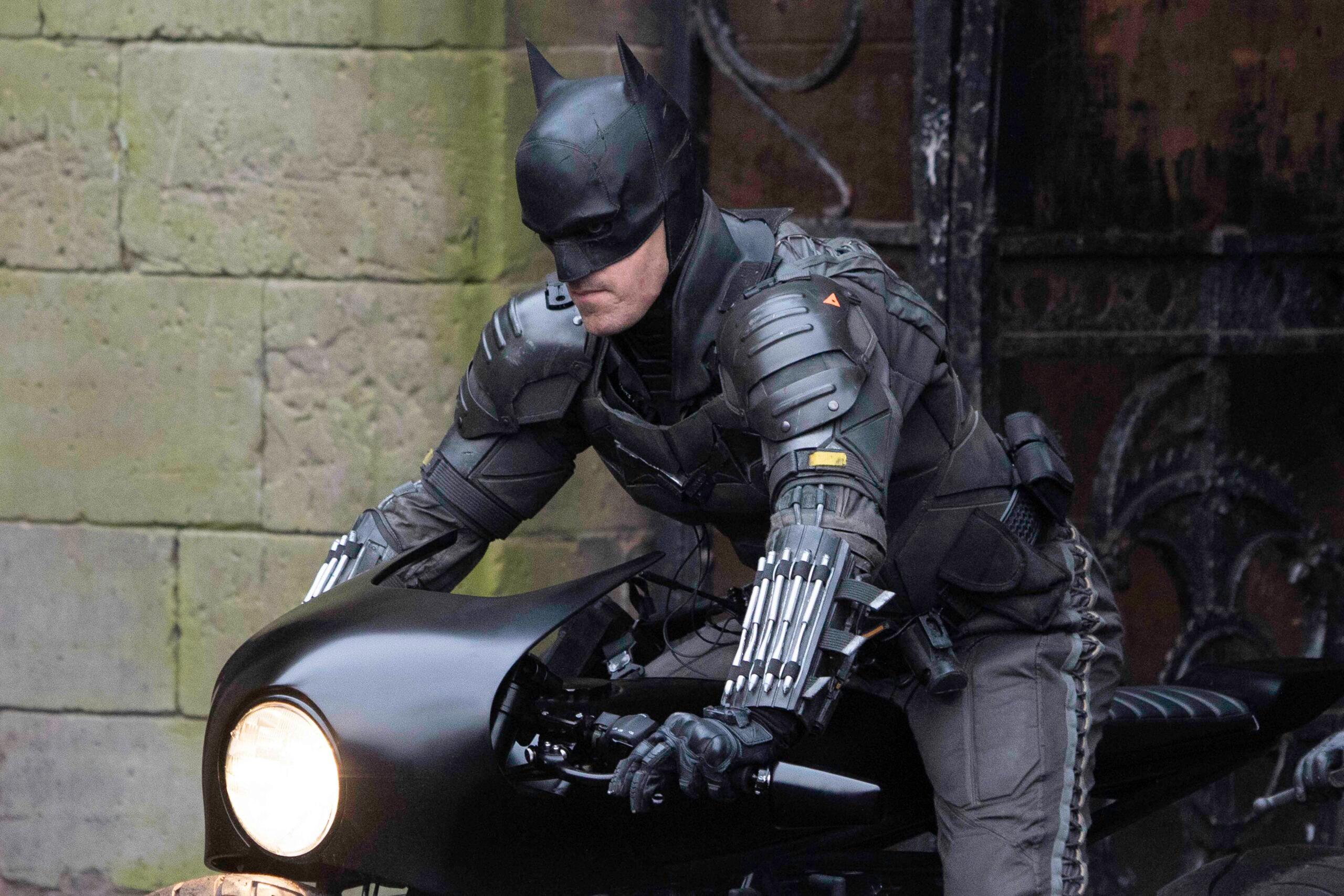 Robert Pattinson's stunt double dressed as Batman rides a motorbike in Liverpool.