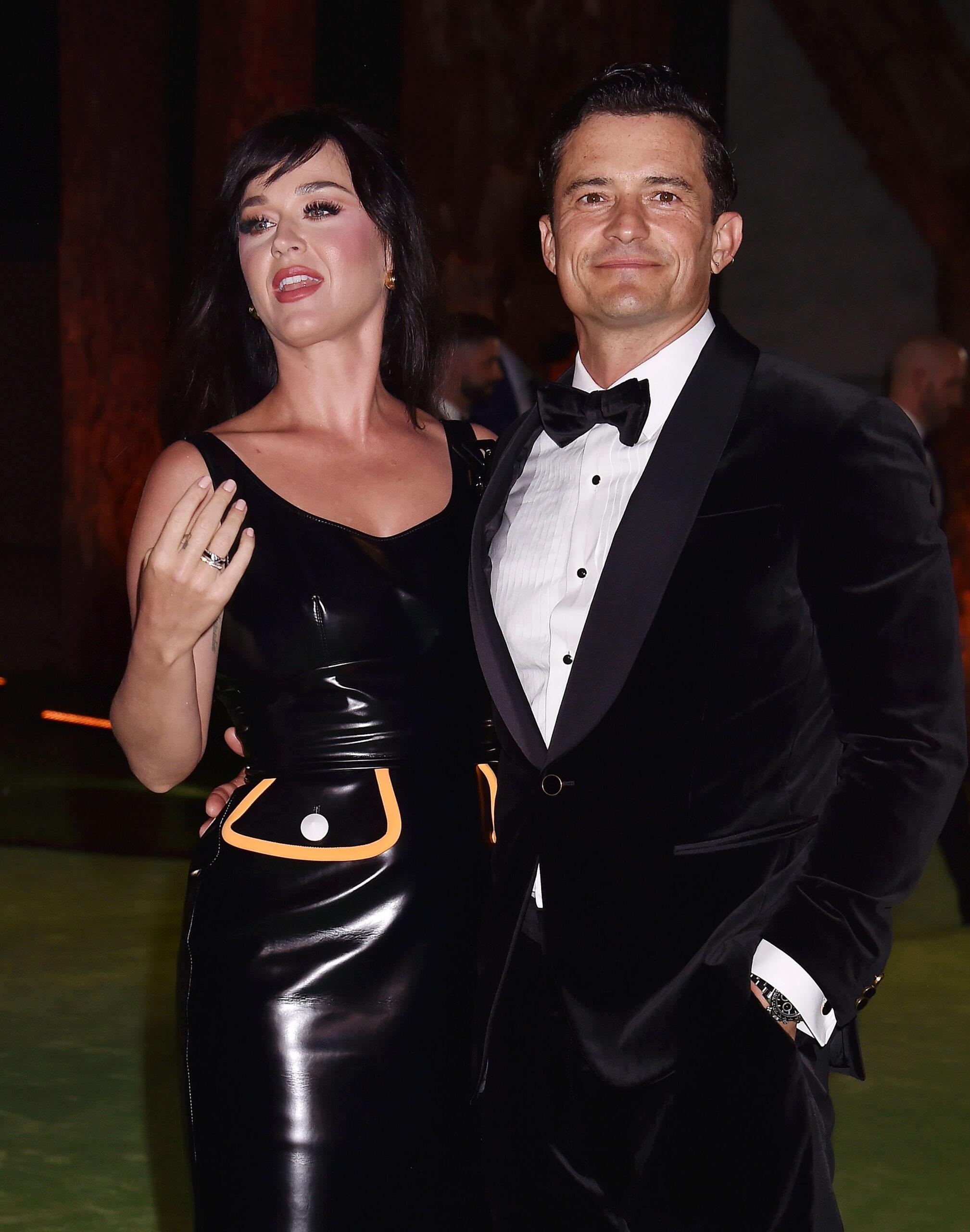 Katy Perry and Orlando Bloom smiling.
