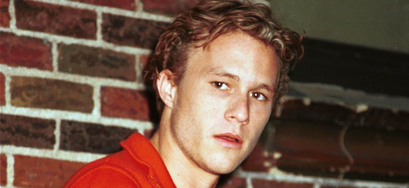 A photo showing Heath Ledger in a red T-shirt.