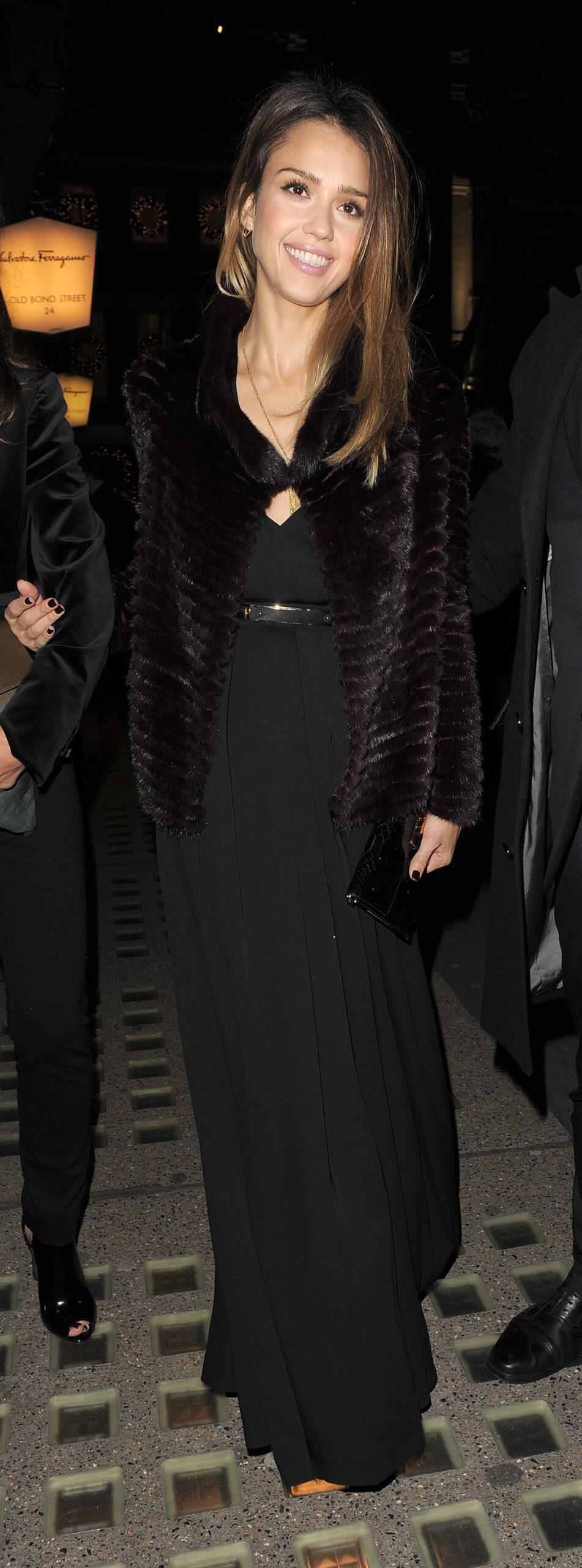 Jessica Alba arriving at the Salvator Ferragamo flagship store launch party on Bond Street in Mayfair The actress wore a fur coat and a black dress