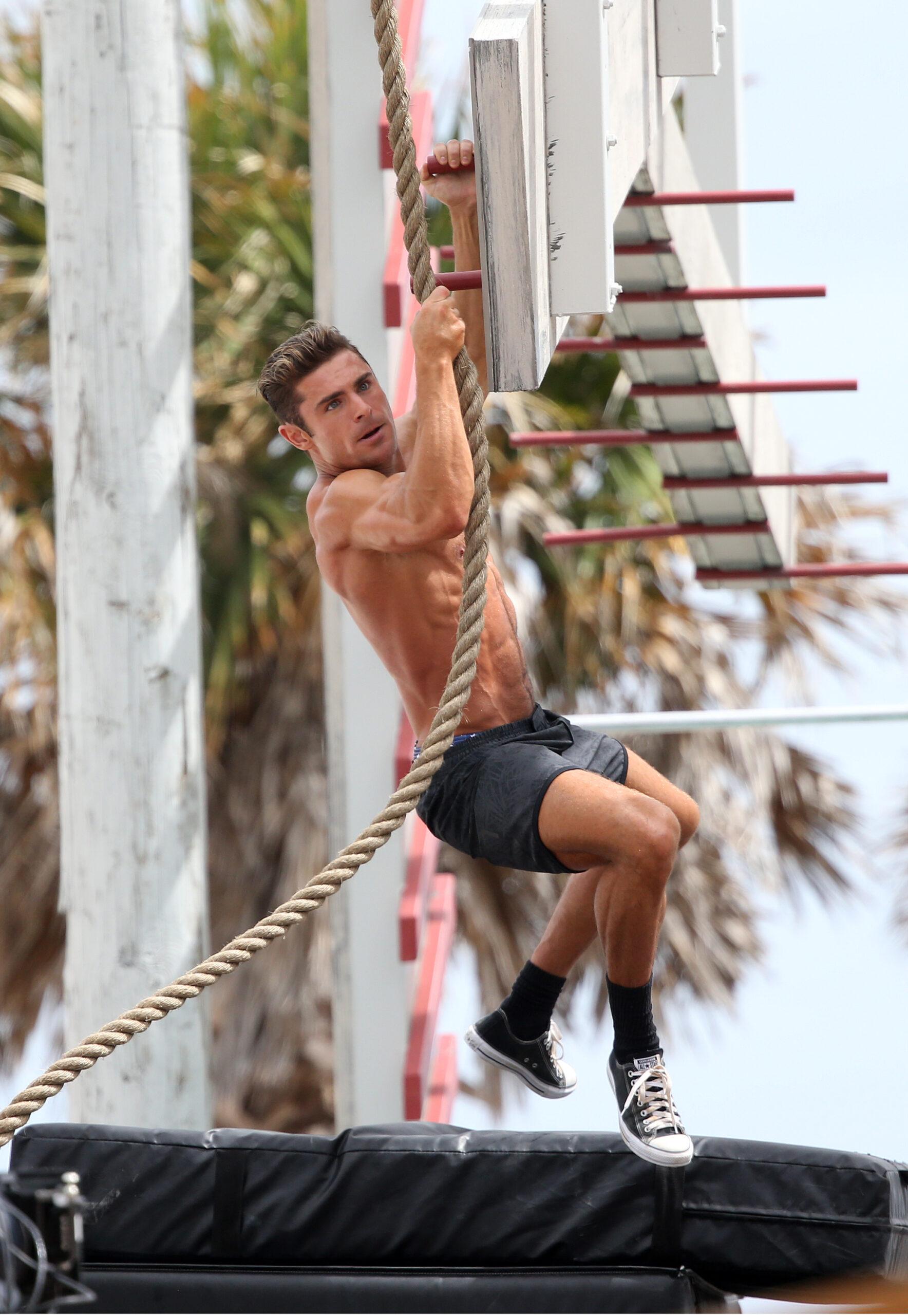 Zac Efron shows off his incredible muscular physique on an obstacle course while filming scenes for the movie Baywatch