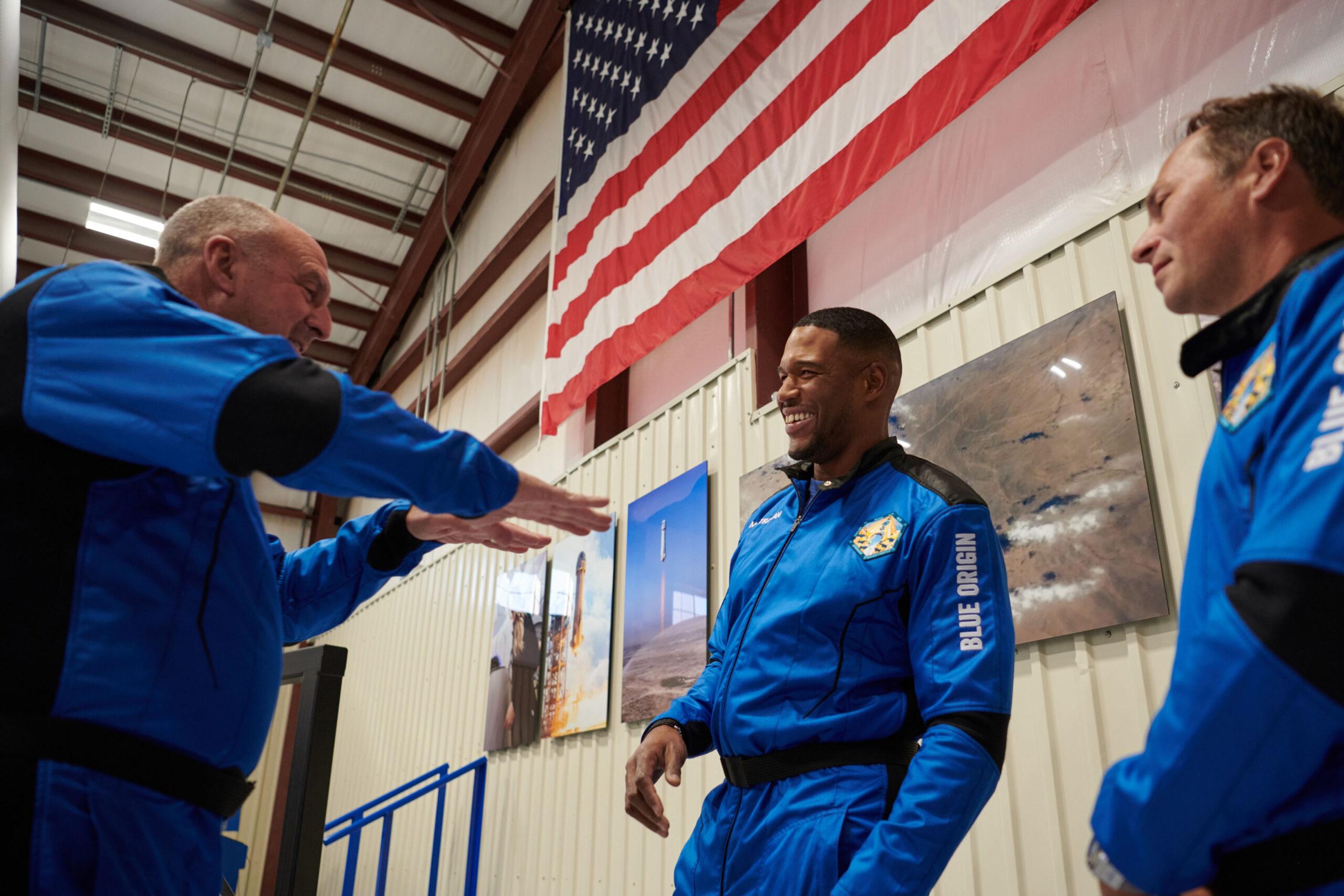 Michael Strahan is all smiles during astronaut training - but will have to wait two extra days before his flight to space with Jeff Bezos Blue Origin