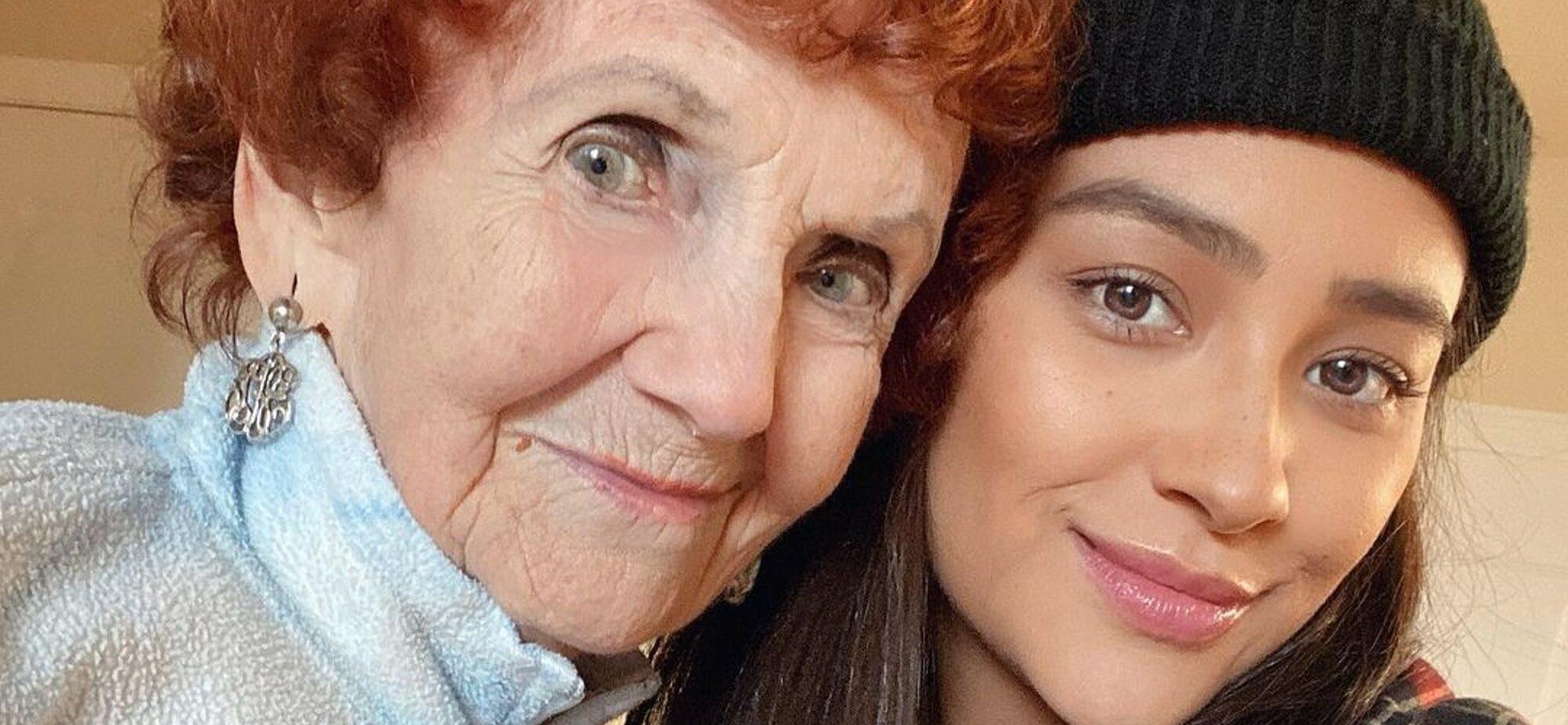 Shay Mitchell and her grandma smiling.